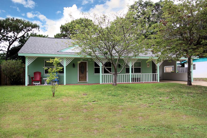 Pool for hot summer days!! This 3 bedrooms and 2 baths Florid Cottage style home offers, large open living room, family room with a cozy fire place, Split bedroom plan, kitchen area with real wood cabinets and large storage room off of living room. It has lawn pump and sprinkler system. Fenced yard with a small shed. House has hurricane shutters and pool covers.