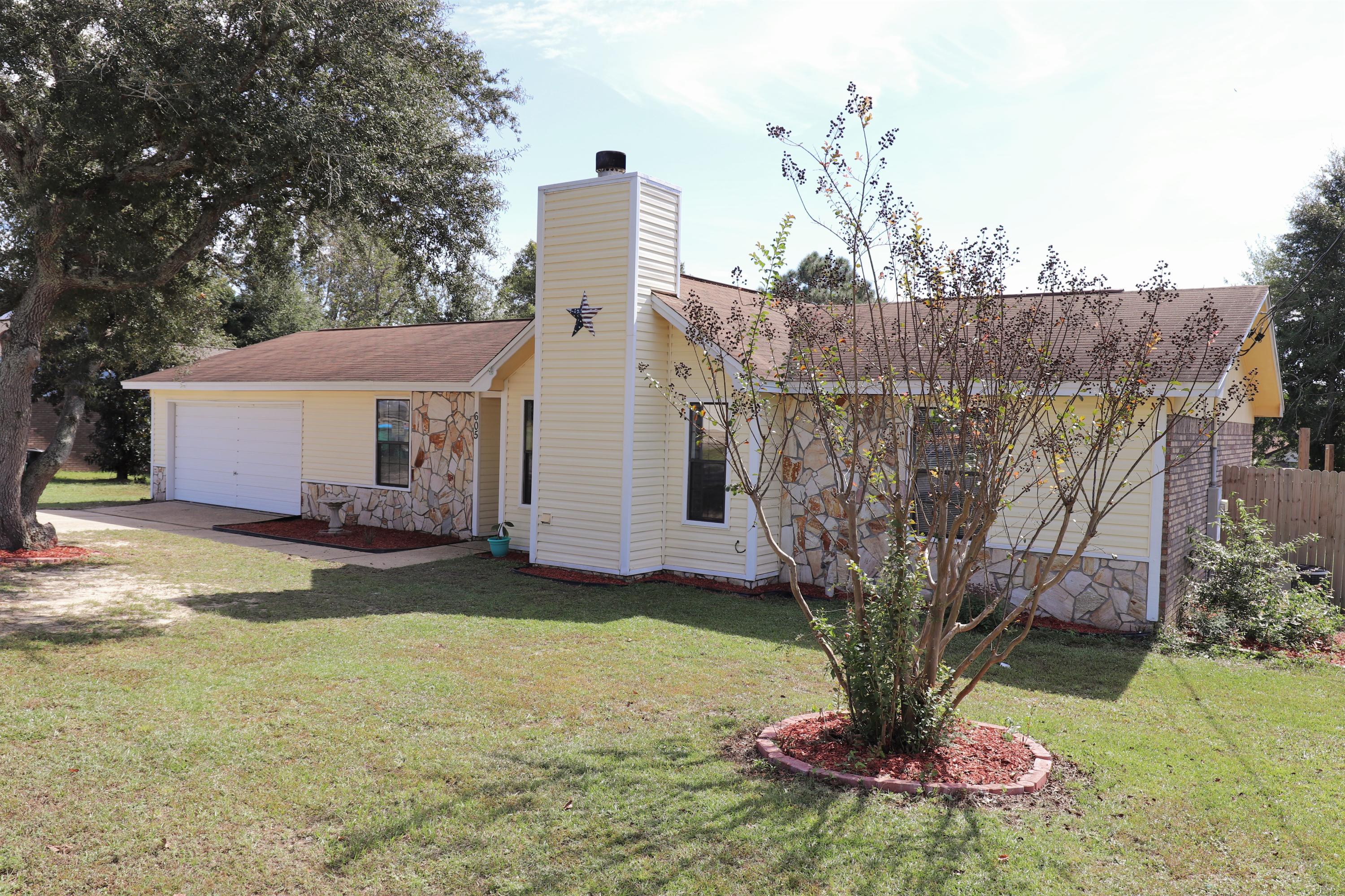 Move-In Ready, split bedroom home in South Crestview! Great neighborhood with park! (Playground, splash pad, basketball court, soccer field) This Ranch style home features inviting Living Room with wood burning fireplace and cathedral ceiling with beam and new wood laminate flooring. Located off of Living Room, is the large dining area and Kitchen, newly tiled floor. Stainless steel appliances and lots of cabinets and counter space! Interior Laundry room offers additional storage. PLUS, an additional heated/cooled sun room for extra living space! Master Bedroom has trey ceiling, and large walk-in closet. Enjoy this beautiful fall weather in this large, level back yard, with deck and canopy! Lots of room to add on! Seller offering 1 yr ORHP Warranty ($425). Security system conveys.