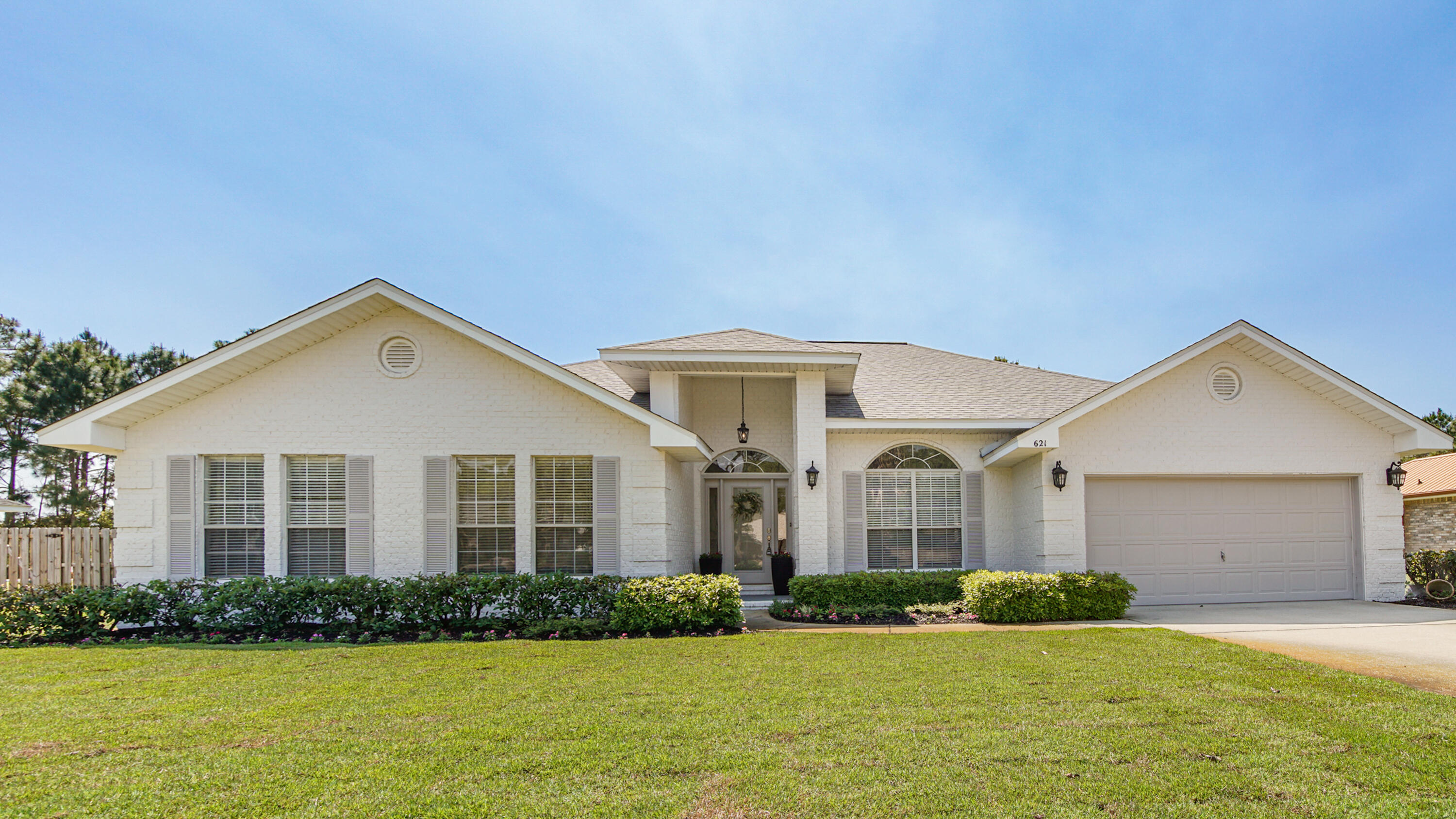 This sprawling, open floor plan, single story brick home is a must see. 4 bedrooms, 3 baths almost 3000 sq ft of living space, sitting on over a half acre lot, backs up to a lake & park. New roof, water heater, appliances, washer/dryer, vinyl plank flooring through out, tubs, toilets, countertops, backsplash, lighting, custom closets. Inside you will find a large kitchen with 2 islands, giving additional counter & seating, ample cabinets, walk-in pantry. Large living with high ceilings. Fenced back yard, big patio, two-car garage plus ample driveway. Close proximity to Choctawhatchee Bay, Publix, Sacred Heart Hospital, shops at Grand Blvd..