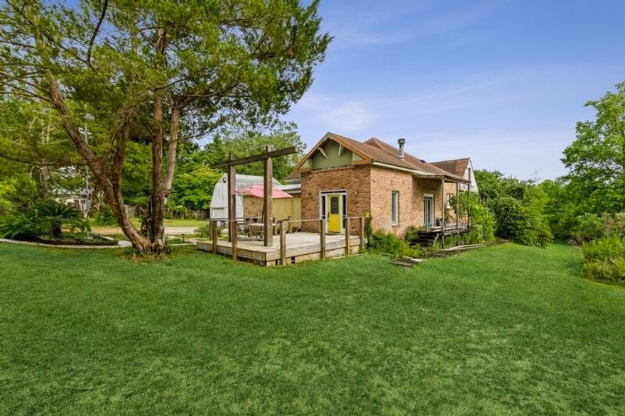 This lovely 2 bedroom, 2 bathroom cottage style pool home is a special gem.  Painless commute to military bases and town center. Exterior includes a sapphire pool and breezy front and back porches. Cross the threshold into a warm welcome that includes maple hardwoods in foyer, kitchen and living spaces, stylish lighting, and a fireplace in the living room. Kitchen brims with fresh updates. The serene primary bedroom includes a sitting space that could be used as a bedroom. The last bedroom is unique and ready for styling. Detached one-car garage converted to workshop. Don't miss this great opportunity to make this home your own - view this home teeming with potential. Want more land? You can own the 14.17 acres of waterfront land behind, check MLS Number 908561.