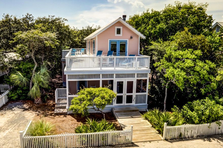 PRICE REDUCED! Quintessential Seaside beach cottage just steps from the Tupelo Street walkover in the fairy tale town of Seaside, Florida. This fully furnished home is a popular resort property, but would also make a delightful second home--or even a full-time residence for those wanting to join the downsizing trend of less clutter and more special moments! The home is designed to enjoy the Seaside lifestyle of spending long days at the beach, enjoying the town center and community amenities with one's neighbors, and blurring the lines between inside and outside living: The fully enclosed front porch invites you to break out the sweet tea and catch up with a friend on the swing. Rinse the sand from between your toes at the outdoor shower before gathering the gang for a feast with the open. ...floorplan living/dining room/kitchen. The large wraparound deck is the ideal place to soak up the sun with your new favorite novel, dine al fresco, or teach the kids why a starry sky is more fascinating than a computer game. On cool winter evenings you can savor the sunset from the beach pavilion with a glass of wine, and then cozy up before the fireplace.
Beautiful narrow plank wood floors enhance the main rooms, with tile in the baths, and nearly new plush carpet in the bedrooms. A bay window brightens the kitchen with natural light, along with granite countertops and white cabinets to keep the seaside feel. One of the bedroom suites is conveniently located on the first floor, while the two upstairs bedrooms offer vaulted ceilings. The home is surrounded by native north Floridian foliage, including some beautiful pines and live oaks. The large lot will allow room for a guest house to be added--a real plus for those whose friends and family will invite themselves to visit and/or for enhancing your potential rental income.
A special opportunity to own a great location in world-renowned Seaside!
Buyer must verify all data, information, and specifications.