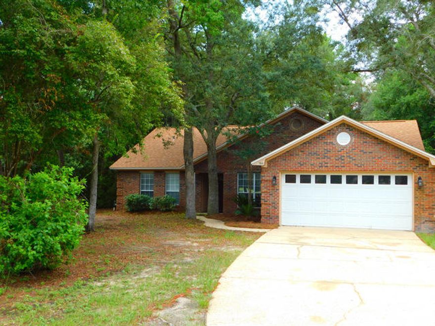 A beautiful brick home located in an excellent Bluewater Bay, cul-de-sac location. This home is move-in ready with a dimensional roof of only two years old, HVAC system is approximately five years old, new dishwasher, new flooring, new interior paint and located on a large level lot. There is a gas fireplace, gas forced air heat, gas hot water, vaulted ceilings, trayed ceilings in the master bedroom, and both a dining and breakfast nook for smaller gatherings. The master bathroom has his/hers walk-in closets, whirlpool tub and a separate walk-in shower. The oversized lot is heavily treed and has so much potential for the gardener. Out back there is an 18 x 22 screened in porch with sky lights. There is a lawn pump and sprinkler system and the home even comes with a termite bond w/ Terminex