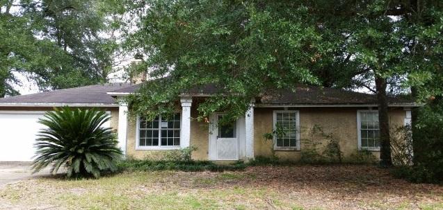 Real Estate Owned REO. Three bedroom, 2 bath home south of I-10 close to bases, schools, shopping, hospitals and amenities. This home features a unique fireplace and the woodwork throughout this home is something you must see to appreciate the potential rustic charm along with tiled flooring with design layouts. Great starter or retirement home, hard to find under 100k.