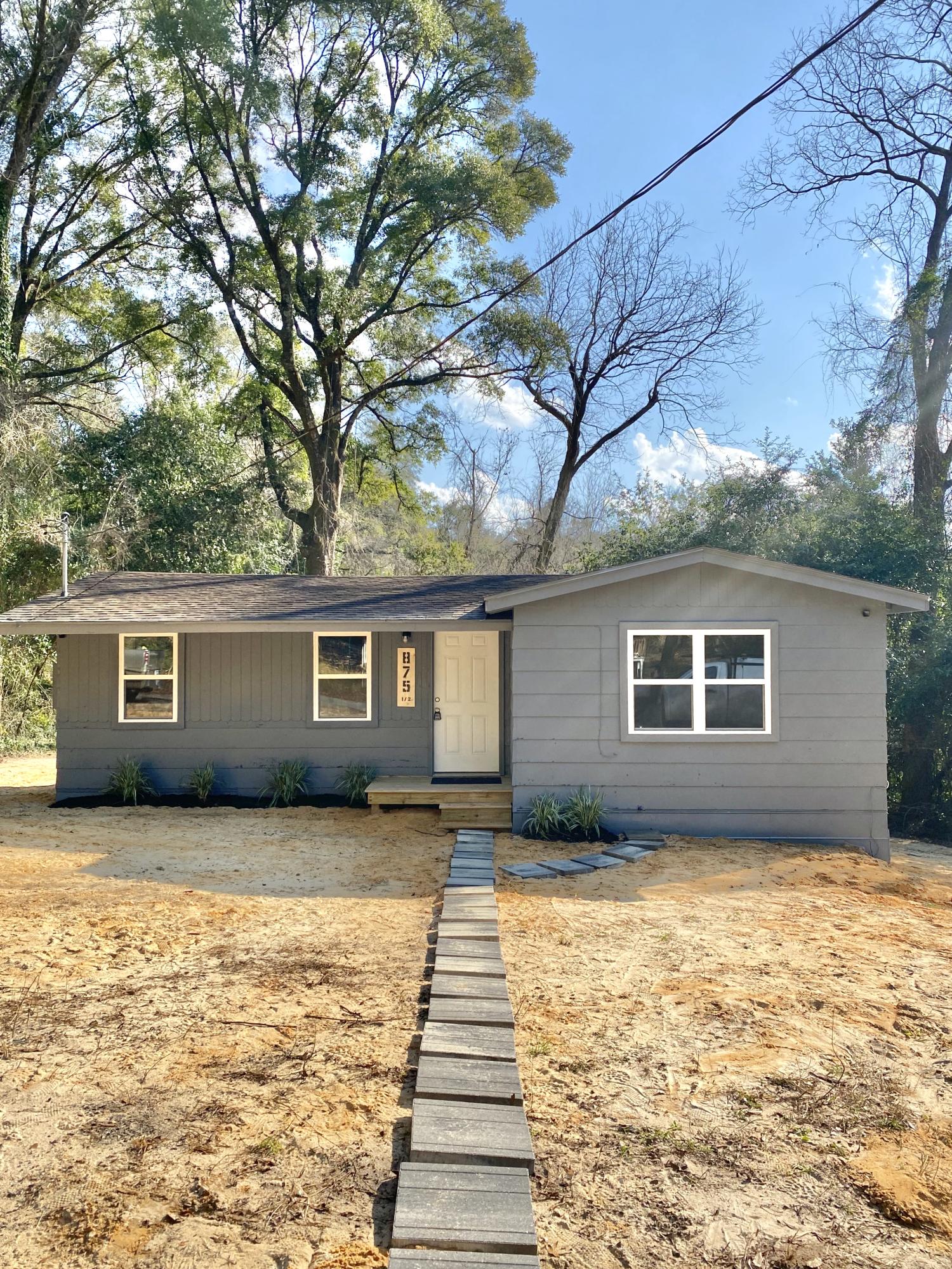 Cute little starter home or potential rental investment! New windows, new carpet and vinyl floors, and fresh paint- come see this updated home in the heart of Crestview! Buyer to verify all measurements.