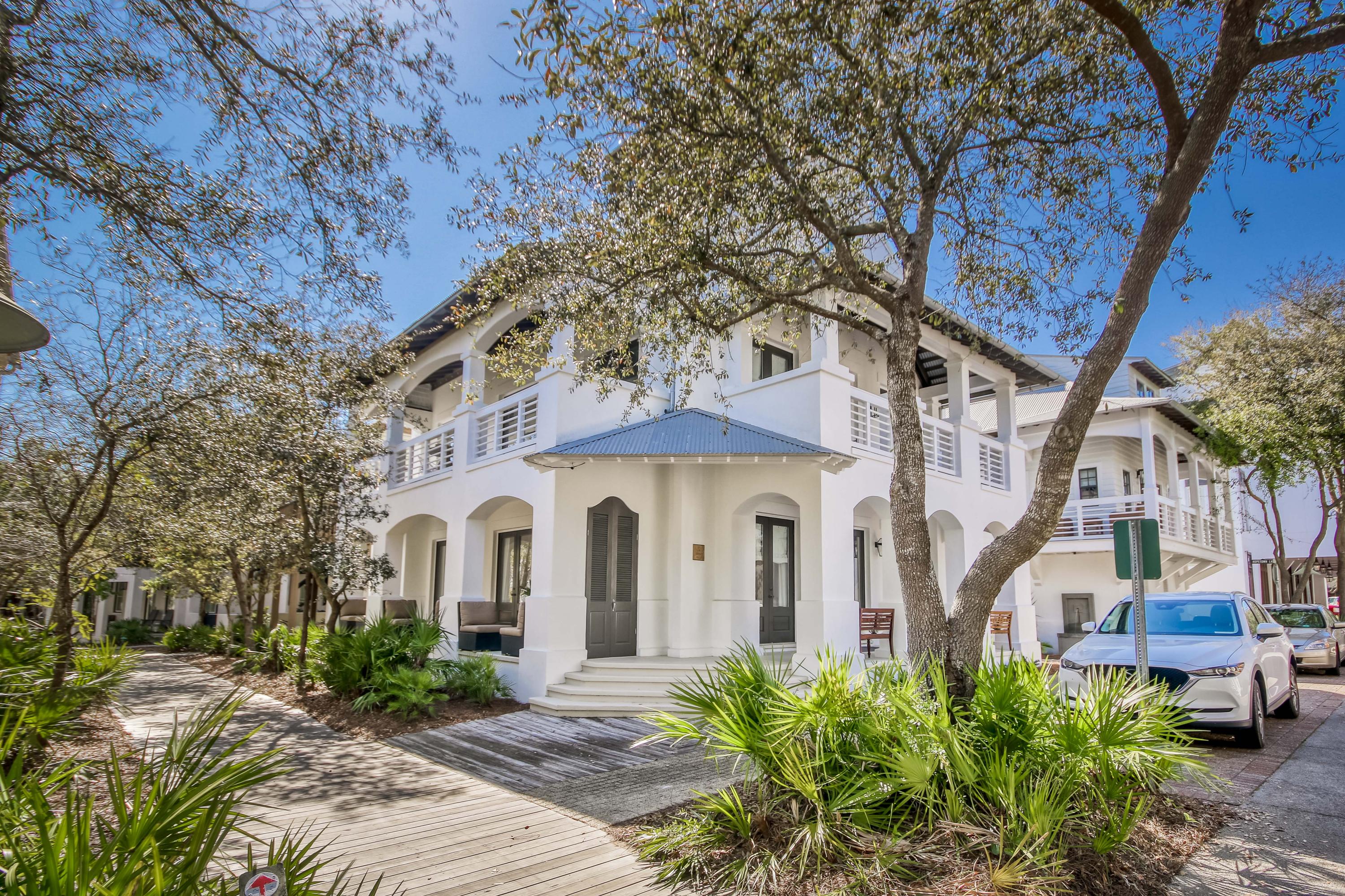 Gulf views from this iconic Rosemary Beach home. Ideal location, just steps down the boardwalk to the beach and Main Street. Elegantly furnished by Jade Interiors of New Orleans. Multiple balconies and large porches are perfect for reading and relaxing. The floor plan is well designed for friends and family. The first level of the main house has three en suite bedrooms, a sitting area and a laundry room. The second level is an open floor plan with the living room, kitchen, dining area and a bar for entertaining. The 3rd level is the master suite and sitting area. The 4th level tower offers 360 degrees views of the gulf and the rooftops of Rosemary and beyond. The carriage house is complete with a second bedroom in the loft. Large outdoor area with room for a pool. Sold fully furnished.