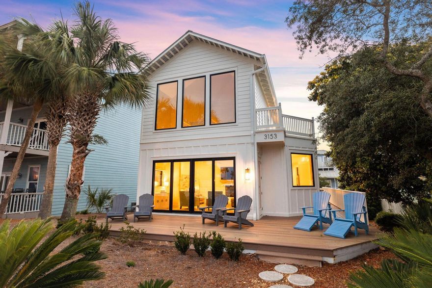 Tucked within beautiful Crystal Beach, this fully updated residence boasts a private pool and no HOA. Taken back to the studs and meticulously renovated in 2022, the property consists of a two-story beach house and a carriage house with two separate en suites each with their own locked entry. Quality craftsmanship and attention to detail are evident throughout, from the high-impact windows and doors to the pristine chef's kitchen. Fully furnished, the property has five bedrooms including a bunk room, and 5.5 baths. Wood-tile flooring flows through the main house's first floor, which has a light open-concept floor plan. The well-appointed kitchen features white cabinets, a central island and natural wood shelving. Commercial-grade stainless steel appliances take care of everyday tasks, leaving you and your guests with the opportunity to enjoy every moment of your vacation. The spacious sitting area has a wall-mounted TV above the inset fireplace. It seamlessly segues into a dining area suitable for family meals and entertaining. A guest suite takes up the remainder of this level. Sliding glass doors open onto a peaceful terrace in the fenced front yard for enjoying cooling sea breezes and glimpses of the Gulf of Mexico. Upstairs, the king master suite shows off a sparkling bathroom with twin vanity and a frameless glass shower. There's also a spacious bunk room served by another bathroom. Head outdoors onto the elevated rear deck where the private pool creates a haven for relaxing and barbecues. The separate carriage house has two further bedrooms, one on each floor each with their own bathroom. There's a second laundry in the downstairs unit and the upstairs unit has a kitchenette amply equipped for rustling up a tasty breakfast before heading out for the day. Location is all-important, and this home is just steps from the stunning white sandy beach. Destin Commons offers endless shopping and dining experiences nearby, along with supermarkets, golf and Henderson Beach State Park. 