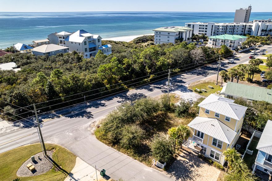 Corner lot ready to build in Seagrove on Hwy 30A. Located 200' East of the new proposed Seagrove Regional Beach Access across from Cafe Thirty-A.  Small four lot subdivision with no build out time and no active HOA.  Possible water views from a home constructed with three stories.
