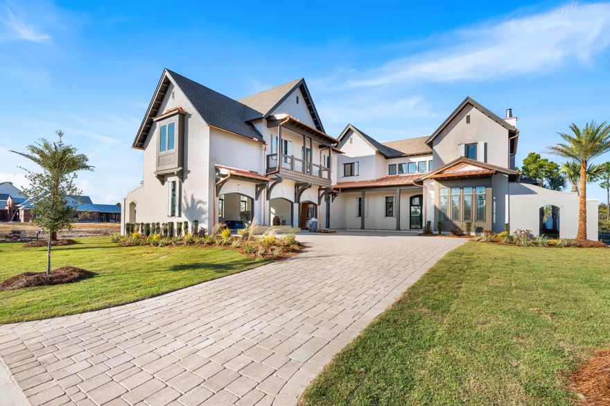 Experience the pinnacle of coastal elegance with this exceptional new construction home on Sandcord Drive. Currently in the finishing stages, this thoughtfully designed 5-bedroom, 5-bathroom, 2-half-bathroom residence showcases exquisite craftsmanship and sophisticated details throughout.The first floor features soaring coffered ceilings and seamless flow to outdoor living areas, while the second floor provides private retreats with a covered balcony overlooking the backyard oasis. A detached carriage house offers flexible guest quarters or additional living space. Expansive covered porches, including screened areas with tongue-and-groove ceilings, extend the living space outdoors. This exceptional home features two primary suites offering unparalleled comfort and privacy, along with three additional generously-sized bedrooms. With five full bathrooms and two powder rooms, the home provides exceptional convenience for family and guests alike.

The stunning white painted brick exterior features custom copper gutters and downspouts complemented by dramatic black-framed windows and an arched entryway. Inside, coffered ceilings with crown molding grace the main living areas, while statement lighting including cascading beaded chandeliers adds elegance throughout. An elegant curved staircase with wood treads and metal railings connects the floors. The chef's kitchen showcases an expansive island, premium quartz countertops, and designer tile backsplash.

The backyard oasis centers around a custom pool with integrated spa featuring modern tile detailing. Multiple covered porches include an outdoor fireplace perfect for year-round entertaining, while a dedicated pool bath adds convenience. A private putting green caters to golf enthusiasts. Professional landscaping with palms and native plantings frames paver driveway and walkways throughout the property.

Located in the highly sought-after Watersound Camp Creek community, this home represents the perfect marriage of timeless design and modern coastal living. With completion anticipated soon, this is a rare opportunity to own a brand-new luxury residence in one of 30A's most desirable neighborhoods.