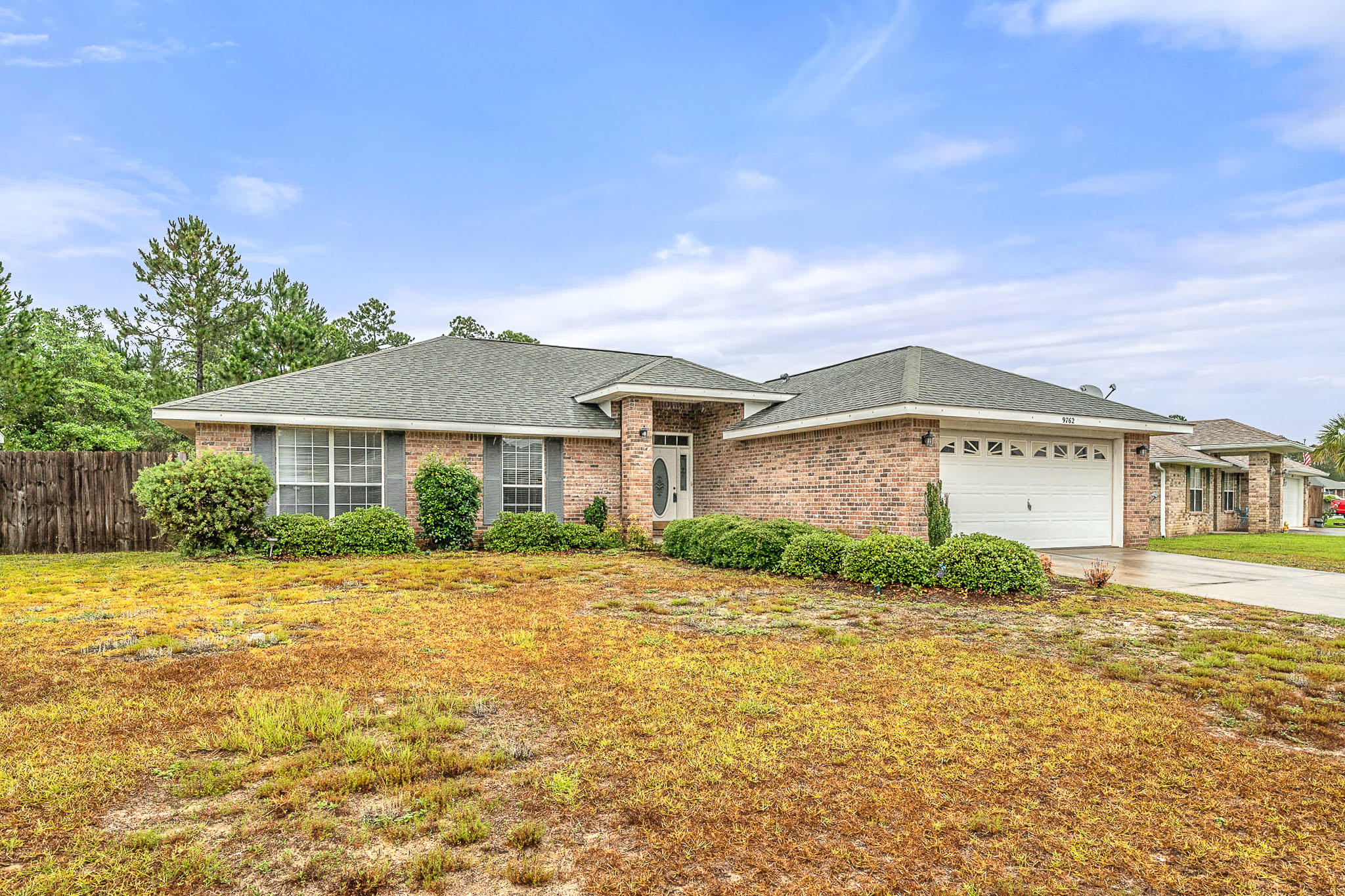 Wonderful all brick home located in Creetwood Place. The home features a split floorplan with a large Master bedroom suite. The master bathroom has a double sink vanity, soaking tub, separate shower, water closet room and large walk in closet. The Great room has a cathedral ceiling and beautiful floor tile for ease of maintenance. The kitchen is bright and open with breakfast bar and features the dining area adjacent. Three additional bedrooms allow for plenty of room for the growing family as well. A large fenced back yard with patio that is perfect for grilling backs up to a green belt area for privacy. The location in East Navarre makes for a short drive to the local military bases as well as a short drive to shopping, dining and of course Navarre Beach.
