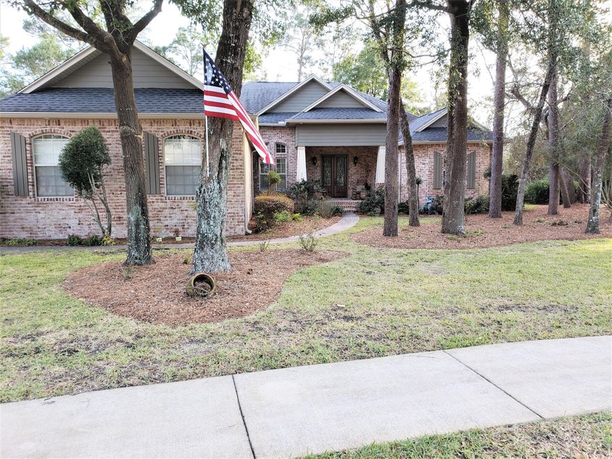 Custom home built by a contractor for himself in the very desirable neighborhood of Swift Creek. 8 foot wood and iron entry doors set the stage for the formal living room's stacked stone fireplace with impressive 12 foot ceiling height. The kitchen has custom cherry cabinets, a large center island, and upgraded stainless steel appliances. The breakfast nook has a large window and glass french doors that lead to a large screened and covered porch area with fireplace. Above this area is a big floored attic. From the porch, you will find a 20 X 30 open deck and the fully fenced-in and very private back yard. The family room located just off the kitchen and breakfast nook is wired for surround sound plus speakers in nearly every room. A ''feature wall'' and large windows complete the room