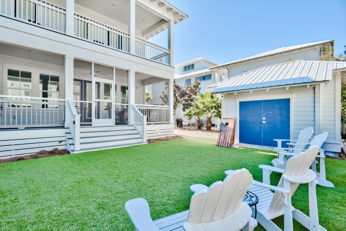 This spectacular five-bedroom, five-and-a-half-bathroom beach home features a prime location directly across from the 12,000-sq-foot lagoon pool in Seacrest Beach and sits on an oversized 50 x 100 foot lot providing plenty of space for enjoyment and potentially your very own private pool. Newly constructed in 2018, this luxurious property comes fully furnished, has a golf-cart garage and storage shed. Enjoy walking to all the shops and restaurants of Rosemary, Alys Beach, and the Village of South Walton. On the first floor, you will find a large guest bedroom with en suite bathroom, as well as the open living, dining and kitchen, which are perfect for family get togethers and entertaining. There is a dining nook off the kitchen with bar area complete with wine fridge and ice machine.
