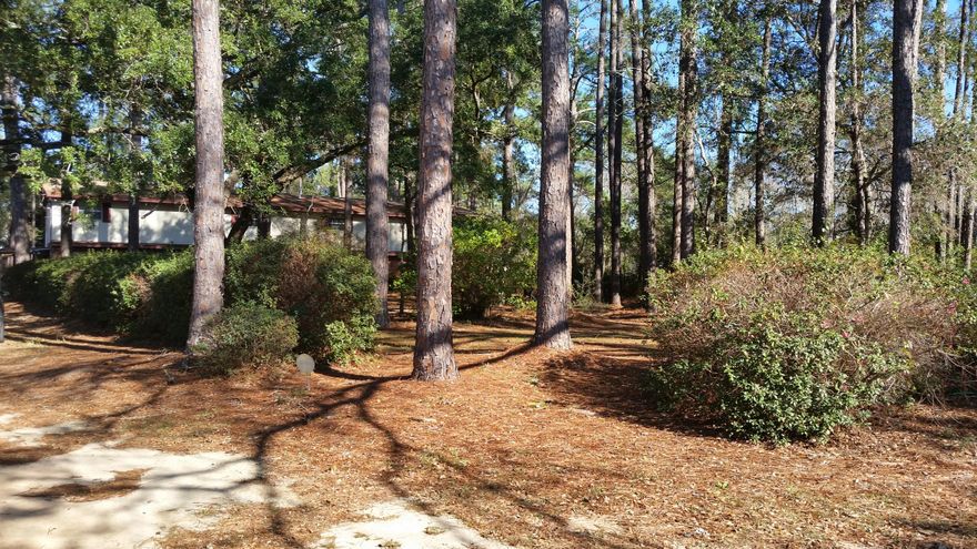 Great 1.35 acre parcel in FT Walton Beach, convenient to Eglin AFB, Hurlburt Field and the FT Walton Beach Medical Center. The value is in the land, currently platted as 2 lots with large home mostly on lot 31. Home is being conveyed ''as is''. Property is zoned R-2, intended to provide medium density residential housing and some certain non-residential uses. According to the Okaloosa County Growth Management, the maximum allowable single family homes is 8 and the maximum allowable townhomes is 21. However, you have to meet all the setbacks and requirements and probably will not be able to get the maximum. Beautiful, large oak trees and nice residential area make this a prime property for development.