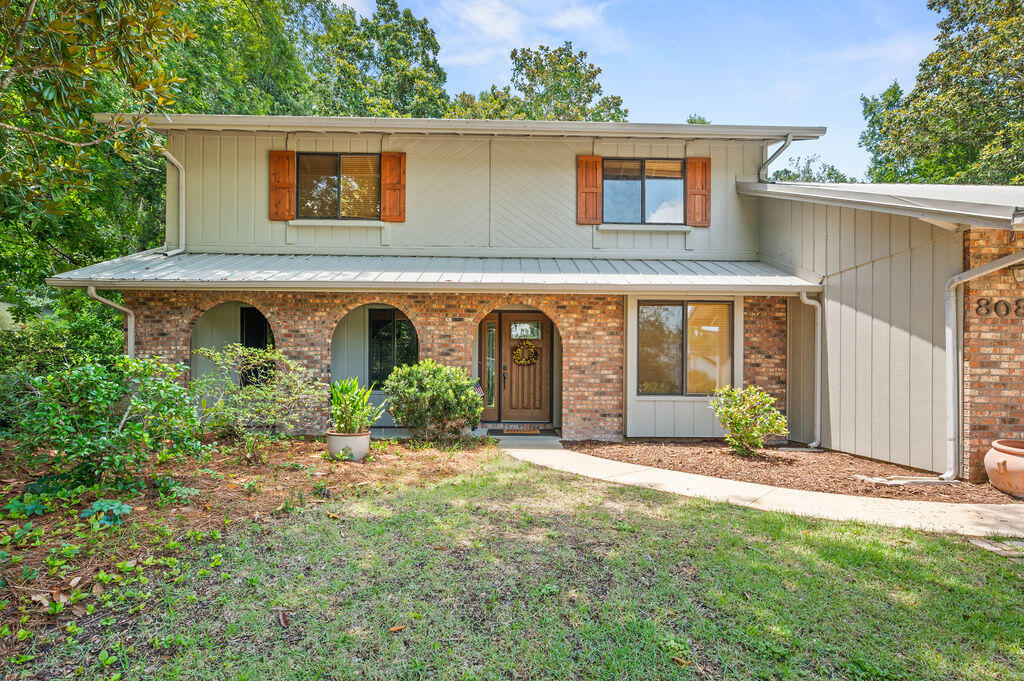 Charming, Well-Cared-For Brick Home with Character, Space & Entertaining Potential-This well-loved 1981 Florida home is full of character and timeless features, nestled on a generous .44-acre lot with a large front yard and a natural backyard filled with native plants offering privacy, shade, and a true Northwest Florida feel. The exterior pairs classic brick construction with wood siding accents, giving it warmth and curb appeal, highlighted by three distinctive front arches and a durable metal roof built to last. Inside, rich dark wood accents, classic wainscoting walls, and a beautiful, coffered ceiling add charm and craftsmanship you just can't find in most newer homes. The living room, dining room, and office/wet bar area are perfect for entertaining, offering a welcoming flow for gatherings of any size. The primary suite features a cedar-lined walk-in closet and a clawfoot tub, adding a touch of vintage elegance. The home has been thoughtfully maintained with updates including a 2024 water heater, 2015 HVAC, new guest bathroom tub, and newer exterior sliding doors. Homes with this kind of character, lot size, and a 3-car garage are increasingly hard to come by. Whether you love the classic details as-is or envision making it your own, this property offers the perfect combination of charm, space, and potential all with the inviting feel of Northwest Florida. All information is believed to be accurate but buyer must verify any information deemed important.