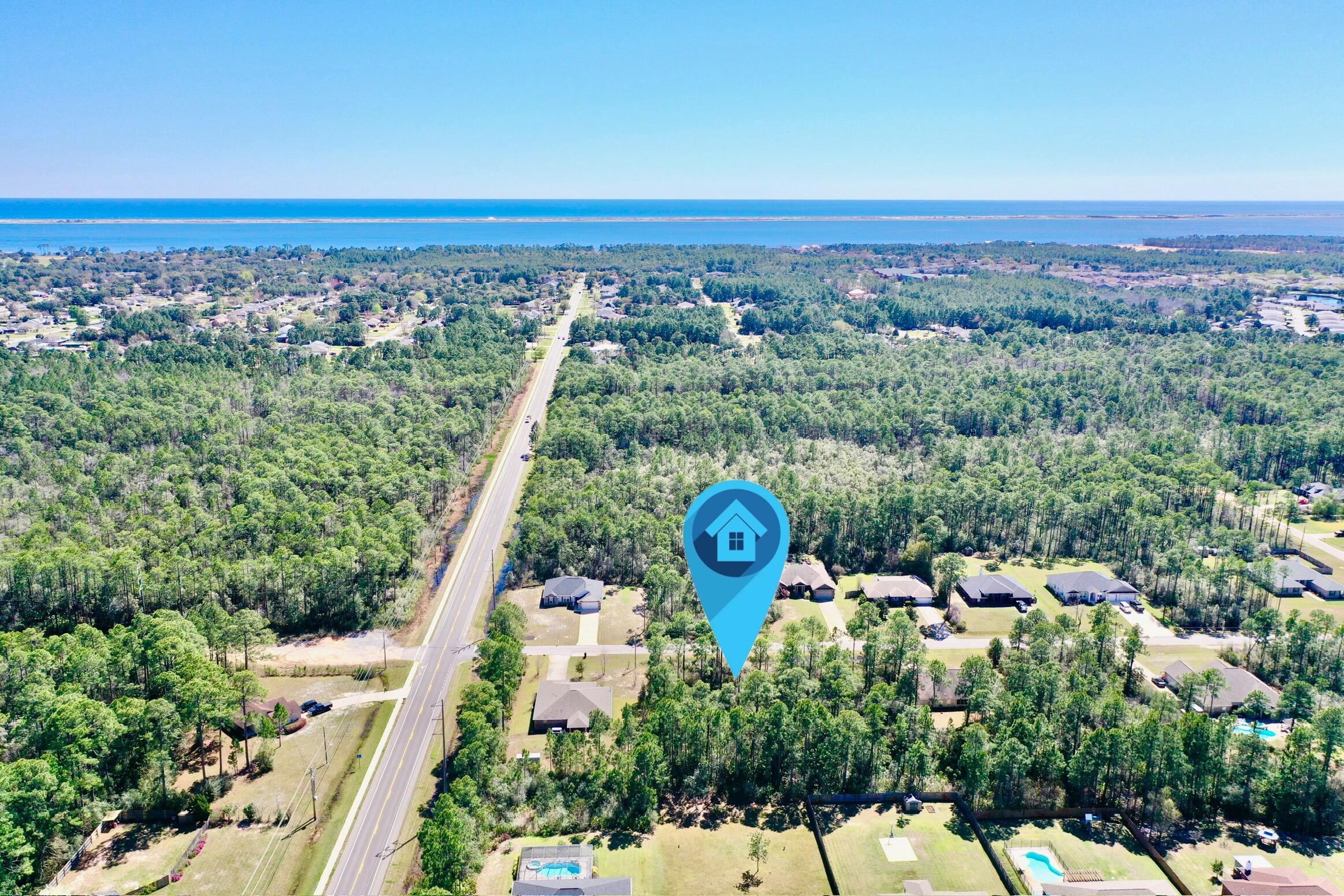 This vacant lot in Holley by the Sea is the perfect canvas for your dream home! Located in a high-demand community, property ownership includes access to an impressive amenity center featuring three pools, a fully equipped fitness facility, and event space with a full kitchen available for private gatherings. Sports enthusiasts will love the eight clay tennis courts and dedicated pickleball courts, while outdoor lovers can take advantage of the private dock, fishing areas, picnic spots, and RV campsites. Just minutes from the white sandy beaches, great dining, and shopping, this is an incredible opportunity to build in one of the area's most desirable neighborhoods!