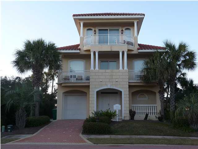 Open great room, dining, and kitchen--all with a Gulf view. 'Destiny Dream' was custom built for the owner. Many extras--three tiered ceiling molding, cozy fireplace, large kitchen island, Sub-Zero refrigerator, and owner's closet. Front and rear balconies provide lots of extra outdoor living space for family and friends to enjoy. Hot tub and grill are on the first floor patio. Second floor balconies afford views of Lake Destiny and the Gulf. The master suite on the third floor is large and spacious with gulf views from the balcony. Community pool and beach walk overs are a short walk away. Garage parking elongated for 2 cars has gate divider to allow a car and toys to remain secure in owner's absence. Being offered fully furnished and rental ready. Please confirm all