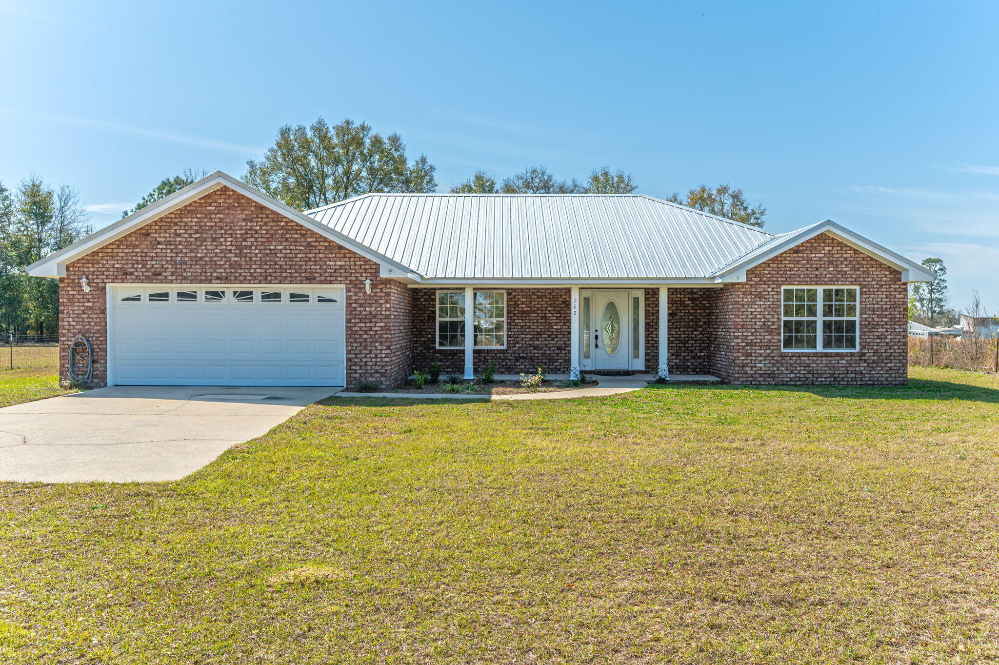 Check out this serene home waiting for your rocking chairs on the front porch. This all brick 3 bedroom 2 bath home sits on little over 1/2 acre. Home has been recently renovated with new roof, new water heater, outside HVAC unit, paint, appliances, quartz counter tops, back splash, sinks, fixtures, exterior doors, interior light fixtures, ceiling fans and LVP flooring. Home is a split floor plan with large living room, a separate dining area and ample size kitchen with breakfast bar. Master bath has a jetted tub and separate shower. Master bedroom has a walkin closet and a linen closet. The home feels much larger than it is. If you like to sit in your yard or on your porch and not be looking at your neighbors, then this place is for you. Shoal River is about 1 mile away. Which is great for canoeing, kayaking and swimming. Buyer to do own due diligence.
Agent is related to seller.