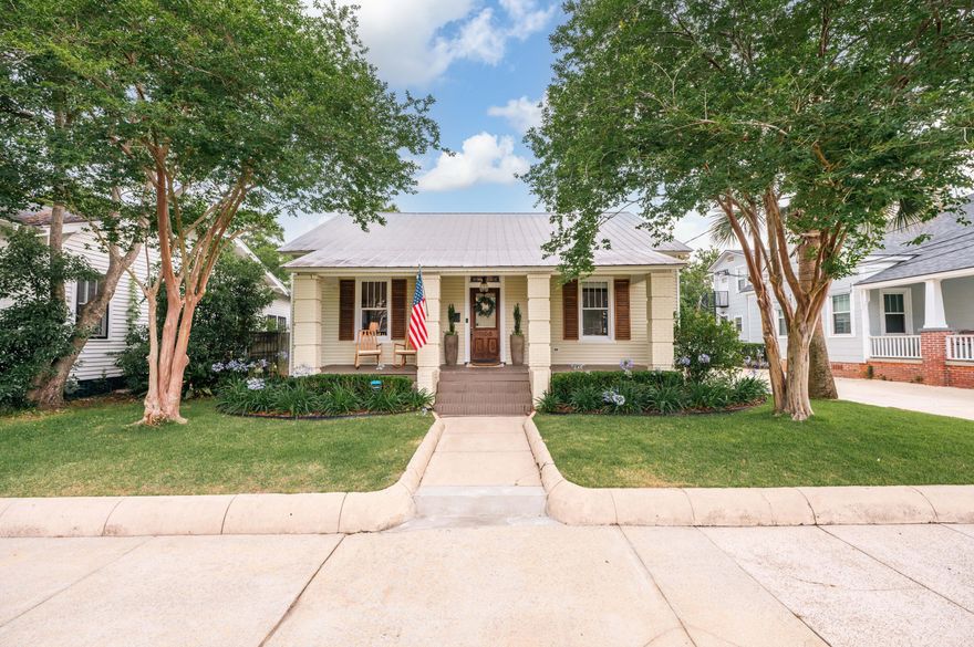 Conveniently located just 1 mile from downtown Pensacola, this stunning home offers classic and original details around every corner. You'll enjoy the original hardwood floors, clawfoot tub, and 11-foot slat ceilings, which make great conversation pieces when entertaining family and friends. The kitchen offers abundant cabinet storage with an island, stainless appliances, cultured marble countertops, and a gas range. The spacious living room has high ceilings, an original mantle, and a separate dining area connected by a cased opening. The three bedrooms are located on the left side of the home, with a mudroom leading out to the backyard. The primary bedroom is suitable for a king-size bed and includes a spacious en-suite bathroom with a shower-tub combo and single vanity. Both additional