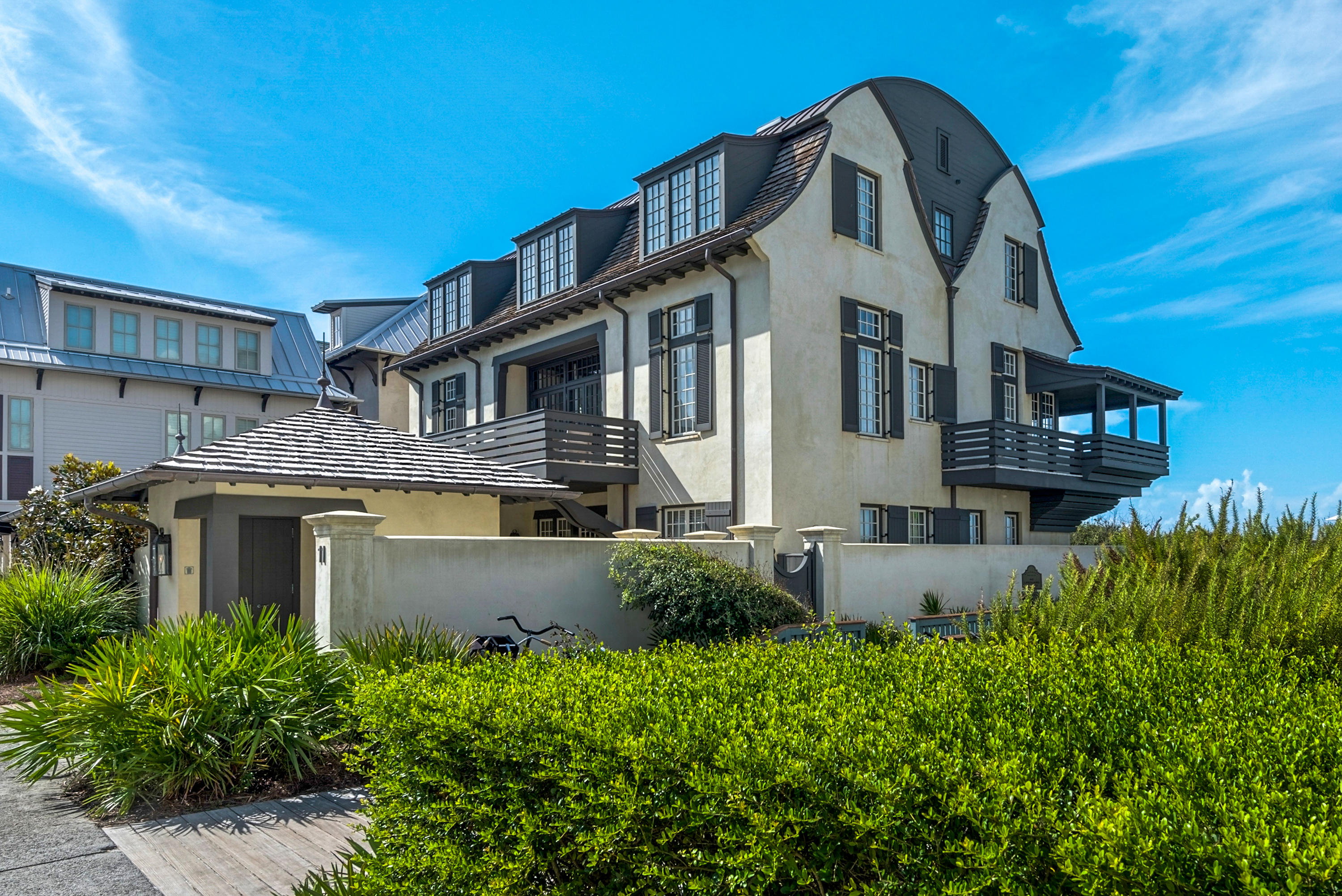 This dynamic, classic McAlpine designed home graces 66 waterfront feet in iconic Rosemary Beach on the Gulf of Mexico. The courtyard, pool and outdoor living spaces are an elegant prelude to the coastal sophistication within this gulf-front gem. Beautiful shades of driftwood grays, airy sky blues and creamy whites reflect the emerald waters throughout the 5000 square feet. The expansive vaulted living areas encompass the open living room, media room and dining room with sweeping views of the sea blue green waters of the gulf. The kitchen is a chef's delight with rustic cypress cabinets and marble countertops. An expansive master suite has panoramic views with a large sitting area and his and hers en suite baths. This home also hosts five additional guest bedrooms with en suite baths.