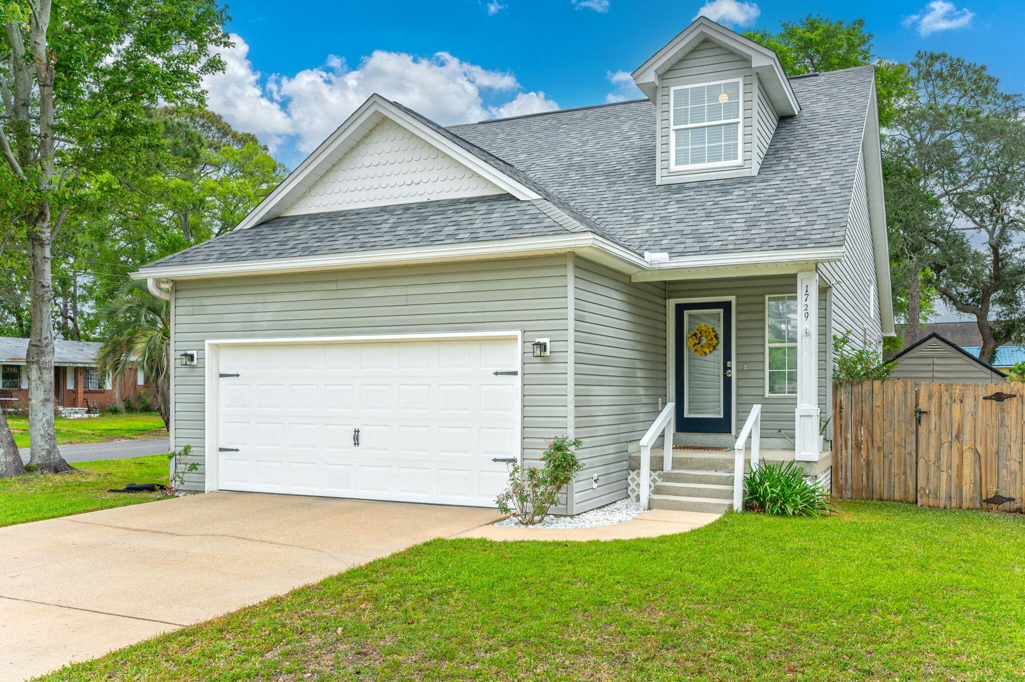 ASSUMABLE VA loan available at 4.75% rate for eligible buyers. Payoff around $393k and monthly payment is currently $2796.65.Welcome home to 1729 Union Ave in Niceville, FL! This well maintained and updated home is located on a beautiful corner lot and boasts a fully fenced private backyard, peek-a-boo views of the bayou, updated flooring, kitchen, primary bathroom, and all major items including 2019 roof, 2024 HVAC, & 2025 water heater. Step inside to find a seamless blend of comfort and style with the open concept first floor layout - vaulted ceiling living room open to the dining area and beautifully appointed kitchen. The kitchen features a large peninsula with abundant storage, stainless appliances, and quartz counters. ---> The primary suite is tucked near the back of the home and features a beautiful primary bathroom with dual vanity, walk-in closet, and glass door shower. 

Upstairs you'll find 2 guest bedrooms and a full bath with shower and tub combination. The 2-car garage features loads of storage while the back covered porch overlooks the fully fenced backyard with room for playing or even a pool. Come see this gem today! 