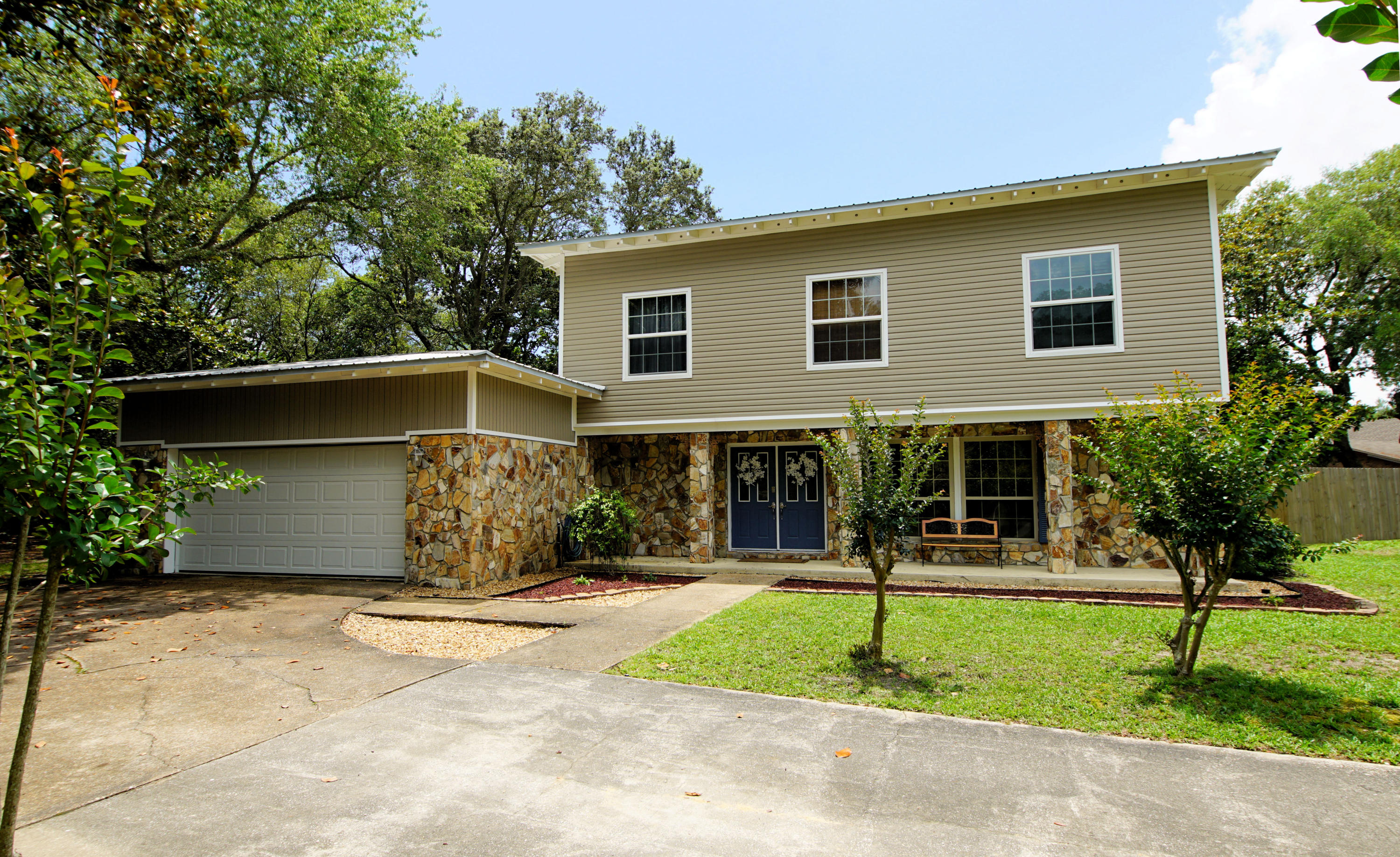 Wonderful location in Poquito Bayou. This lovely 5 bedroom updated sits on a large half acre corner lot with fenced yard and inground pool. Inside there are 2 living spaces, a nicely upgraded kitchen with stainless appliances, legacy cabinets and soft close drawers. There are 4 bedrooms on the second floor to include the large master suite. There is a bedroom and bathroom on the first floor that is currently being used as an office. Outside there is an enclosed porch with fans that overlooks the large back yard and pool. Home has a metal roof that was put on in 2007 and pool pump replaced in 2011. There is a waterfront park on Poquito Rd for easy access for boating/kayaking and paddle boarding.Close to Eglin and Hurlburt AFB, shopping and the beaches.