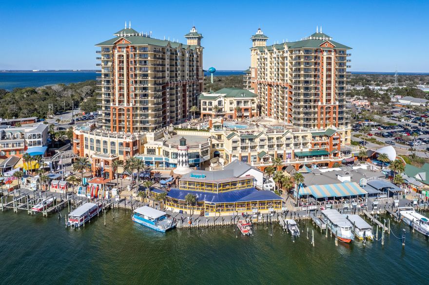 Located directly on the Destin Harbor, in the heart of downtown, this 3 bedroom, 3 full bathroom unit offers views of the Gulf from two separate covered balconies. Inside this unit, you'll find all the comforts of home. The open floor plan offers a dining area, a breakfast bar, granite counter tops, and stainless steel appliances. All three bathrooms have spacious walk-in showers, and the primary suite has a double granite vanity with a jetted tub and a private balcony to enjoy your morning coffee. Emerald Grande offers 24-hour security, a spa, community pool and jacuzzi, event space, its own restaurant and a ferry to take you over to Emerald Grande's private beach! You'll enjoy a wide array of dining options just below the unit directly on the harbor, including the world-famous AJ's just