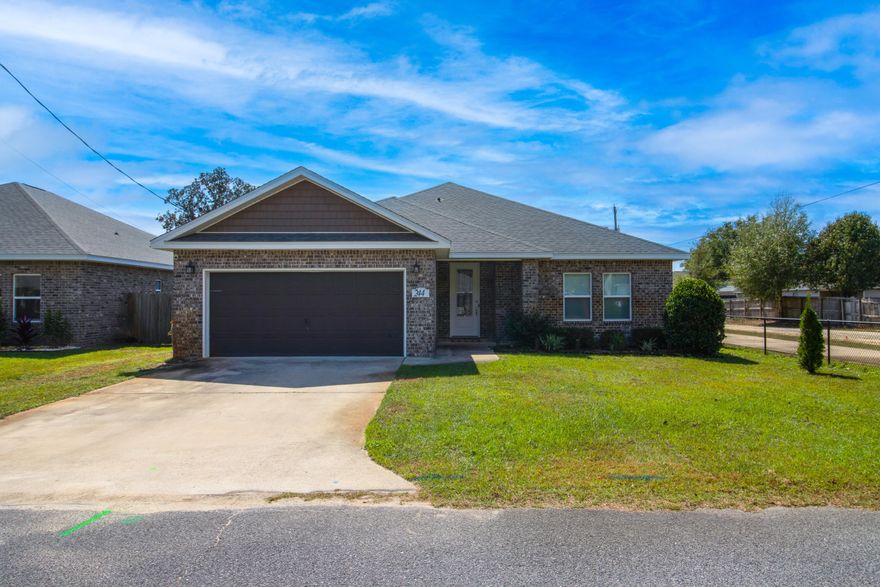 New to the market, please consider this turnkey 3-bed/2-bath home in Mary Esther, Florida, offering 1,936 SF of thoughtfully designed living space! Built in 2019, this open-concept features a spacious living room with tray ceilings, tile flooring in all main areas, and plush carpet in the bedrooms. The kitchen includes stainless steel appliances, wood cabinetry, granite countertops with a breakfast bar, and opens into the dining and living spaces. The primary suite offers his-and-hers closets, double vanity, tub, separate stand-up shower, and private water closet to buyers. The formally open back porch has been enclosed to create a bright Florida room with a mini-split unit for year-round comfort. Additional highlights include a large fenced backyard, two-car garage, washer and dryer well with sprinkler system, and a fully finished interior with designer cabinetry, crown molding. This home combines quality craftsmanship and modern finishes in a prime Mary Esther location, approximately 3.8 miles from Hurburt Field, 15.8 miles from Eglin AFB, and 11.3 miles to Okaloosa Island Beaches!