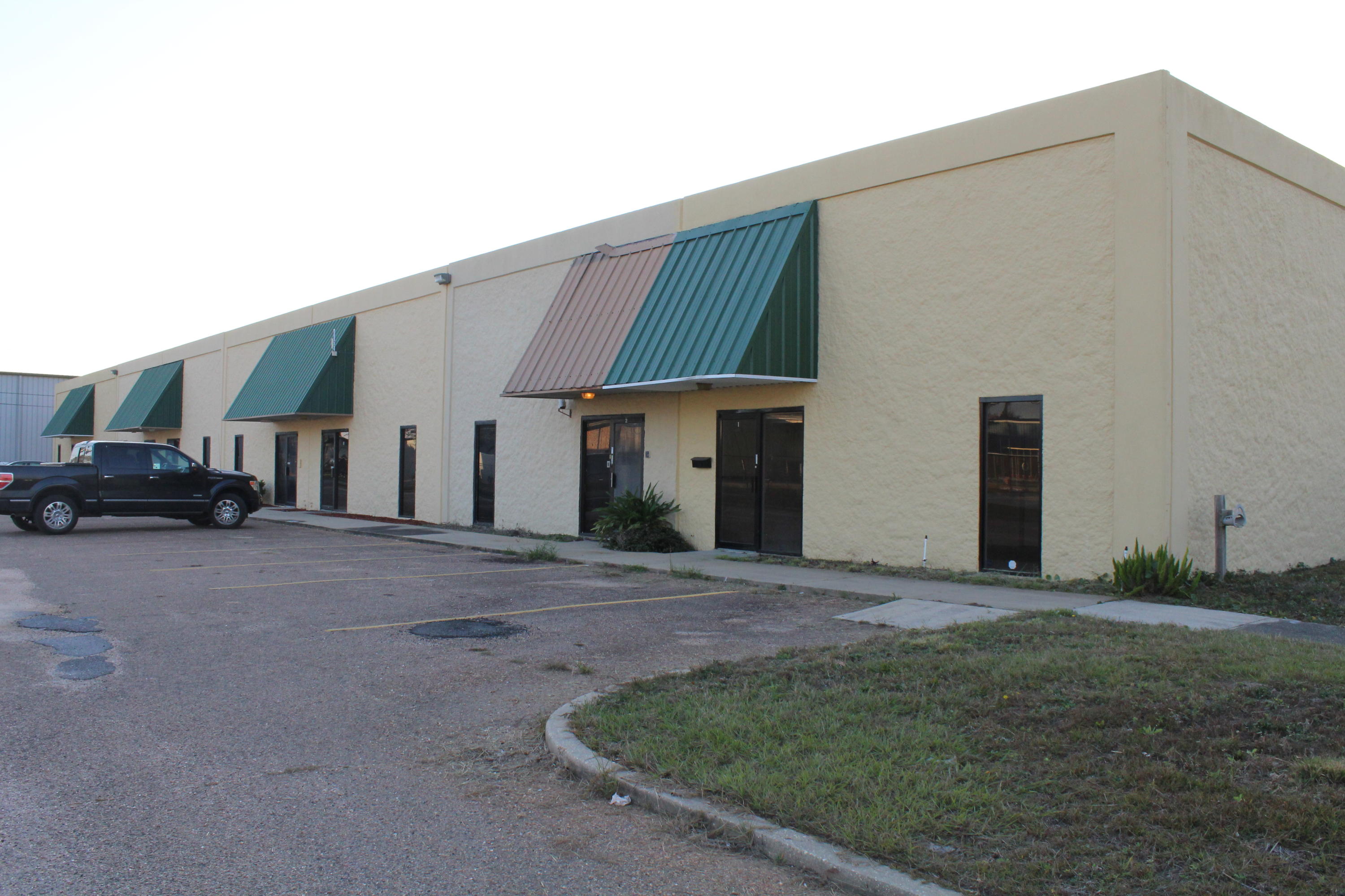 Desirable warehouse space with a built-in office! Once in the front door there is a receiving area that has a pass through window into a reception area. There are 2 private offices, a common area, a private bathroom, and a kitchen area. The warehouse space is 23x43 and has a 10' rollup door. There is an alleyway at the back of the complex for easy access to the warehouse and an abundance of parking for customers in front. This one won't last long so call for more details before it's too late!