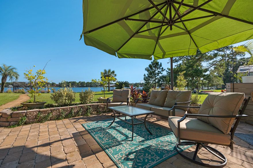 Waterfront Home with Spacious Outdoor Living Perfect for EntertainingThis 4-bedroom, 3-bath home on Cinco Bayou offers a tranquil setting that is also perfect for hosting. It's ideal for entertaining with a generous living room with multiple French doors to the waterfront and a floor to ceiling gray stack stone fireplace. A board deck, paver patio, grass lawn and inviting paver pathway to the boat slip and bay waters provide wonderful outdoor living and recreation options.Waterfall countertops, fine appliances, a white brick wall, double white porcelain farmhouse sink and spacious kitchen window over the sink provide an almost glamorous setting in the heart of the home.