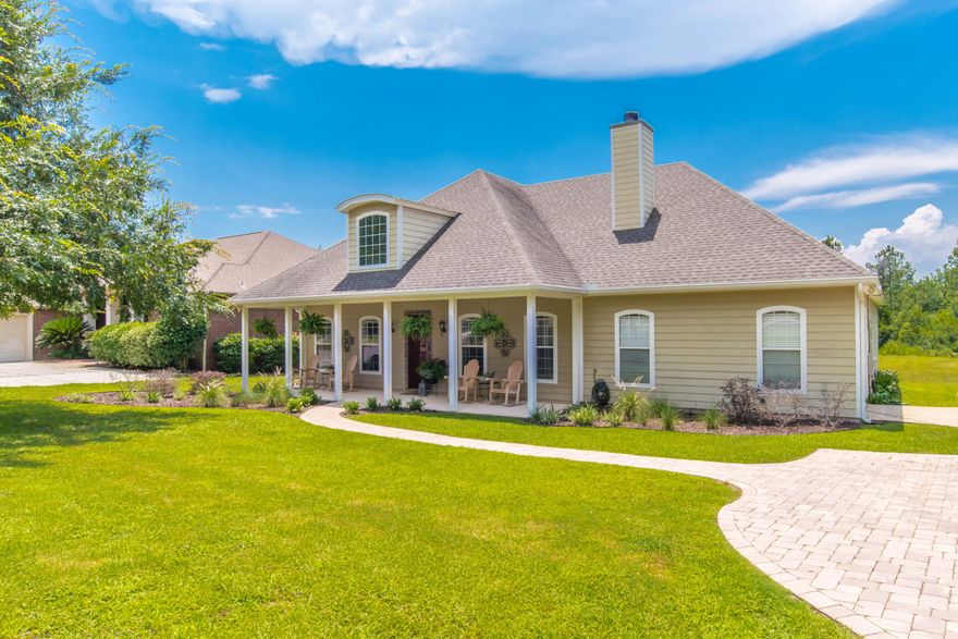 Welcome to your custom built DREAM home with your very own backyard oasis! Built with ICF (Insulated Concrete Form) home construction complete with Hardee Plank siding, this home is built to last! Upon arrival, note the paver stone driveway and covered front porch full of southern charm. This gorgeous 4 bedroom, 3 bathroom custom home will dazzle you with it's unique finishes, providing an open split floor plan, vaulted ceilings, ample living and entertaining space. You'll also enjoy the beautiful Cypress wood floors and Juniper tongue and groove ceiling and accent wall. The open kitchen boasts of granite counter tops, mosaic tile back splash, stainless steel appliances, farm style stainless steel sink, over-sized kitchen island, brick floors, 5 burner stove and custom Cherry cabinetry. In Into the living room, note the built in custom Cherry book shelves and wood burning fireplace. The spacious master suite comes fully equipped with boxed ceilings, his and hers walk-in-closets closets, 2 separate vanities, jetted tub, separate shower and water closet. The additional two bedrooms downstairs have large walk-in-closets and the third bedroom upstairs would also make an excellent office, gym or media room. Step out onto your screened enclosed covered patio while entertaining and enjoy a warm Florida evening without dealing with those pesky bugs! You'll also enjoy the open wood deck, salt water pool equipped with a Modular Media pool pump which is highly energy efficient making for inexpensive upkeep. Lounge around your new pool encompassed by gorgeous paver stones. What's better than your very own tiki bar equipped with a full kitchen, granite counter tops, outdoor mini fridge and gas fire pit! This back yard truly has it all including fenced dog run! Abutted to Tom King Bayou. What an Oasis! Just 9 miles to the white sand beaches of Navarre Beach and 18 miles to Hurlburt Field. Plenty or room for RV & boat parking. Don't miss your chance at Florida living at its finest!