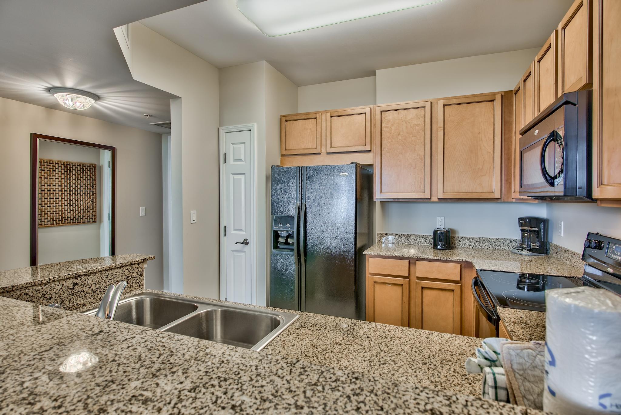 This 4th floor junior two-bedroom condo offers views overlooking the pool w/Gulf views too! Kitchen boasts maple cabinetry and granite countertops. The open floor plan is perfect for entertaining. Enjoy the many onsite amenities, including a tropical oasis landscaped pool area boasting Destin's largest lagoon pool with waterfall features, a kiddie pool, hot tub, and splash pad, as well as a playground, fitness center, and tennis and basketball courts. The resort offers complimentary shuttle service to the beach for you to enjoy Destin's world famous sugar-white sand and emerald-colored water beaches. On site resturaunt, coffee shop and ''Good Vibes'' pool bar are extra amenities for you and your guests to enjoy! Rental projections of $35k make the Palms a great investment or 2nd home.