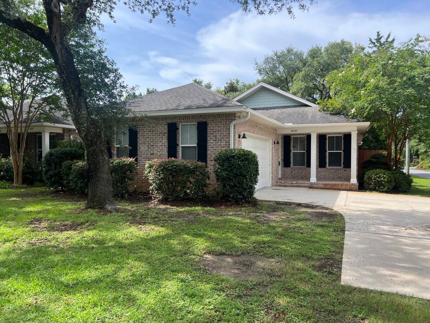 A FRESH new PRICE and fresh Sherwin Williams Paint throughout! Charming All-Brick Craftsman Style Home in the Heart of Niceville with Designer Touches and Timeless Appeal.Nestled beneath ancient oak trees in the heart of Niceville, this beautifully crafted, low-maintenance all-brick home offers comfort, elegance, and charm in equal measure. From the moment you arrive, the herringbone brick front porch with real wood shutters invites you into a space that feels both classic and fresh.Step inside to an airy, open floorplan featuring gleaming hardwood and tile floors throughout--absolutely no carpet! The gourmet kitchen is a showstopper, complete with granite countertops, stainless steel appliances, a stylish breakfast bar with pendant lighting overlooking the spacious living area, a super cool coffee bar, and a generously sized pantry. Its a space designed for both daily life and effortless entertaining.

The dreamy primary suite offers a peaceful retreat with a spacious walk-in closet and a luxurious en-suite bath featuring double vanities and a custom walk-in shower. Every detail is elevated by thoughtful finishessmooth ceilings with recessed lighting, elegant crown molding, finely crafted wood-trimmed windows and doors, and soaring 9' ceilings with grand 8' doors that elevate every room with sophistication.

Outdoors, enjoy the privacy of your fenced backyard while relaxing on the screened-in back porch, perfect for morning coffee or evening gatherings. A gated entrance from Sycamore Street offers easy side access to the yard. Towering oak trees provide natural beauty and even the perfect spot to hang a tire swing. The oversized double garage gives you plenty of space for vehicles, tools, or weekend toys, and there's a dedicated laundry room, too.

This home truly has it all: location, design, comfort, and character. Don't miss your chance to fall in love with every detail. Call your Realtor TODAY!

