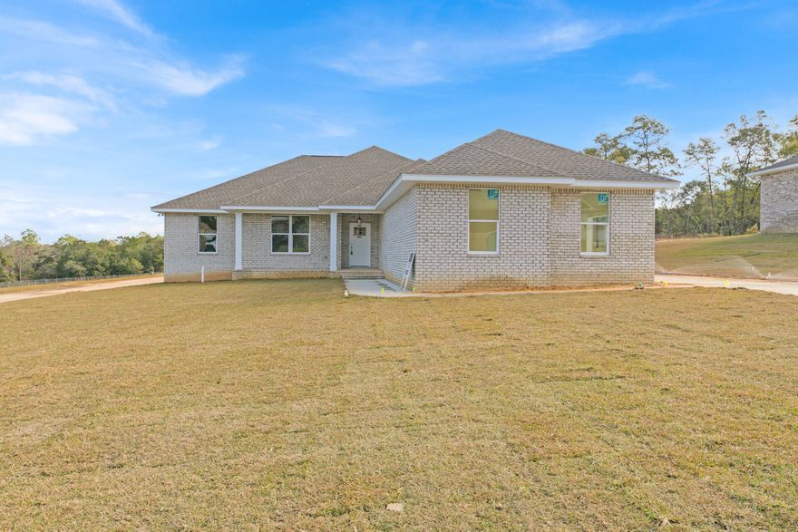 NEW HOME built by a Parade of Homes winner on a 1/2 acre corner lot!! This 4 bed 3 bath brick home with 3 car garage home is stunning. Large open living area, kitchen and dining area overlook the huge back yard. Kitchen has upgraded quartz counters, white and gray cabinetry with tile backsplash!  Master bath is the perfect setup with double vanities, separate tiled shower and a walk in closet. Beautiful LVP throughout the entire home with no carpet.