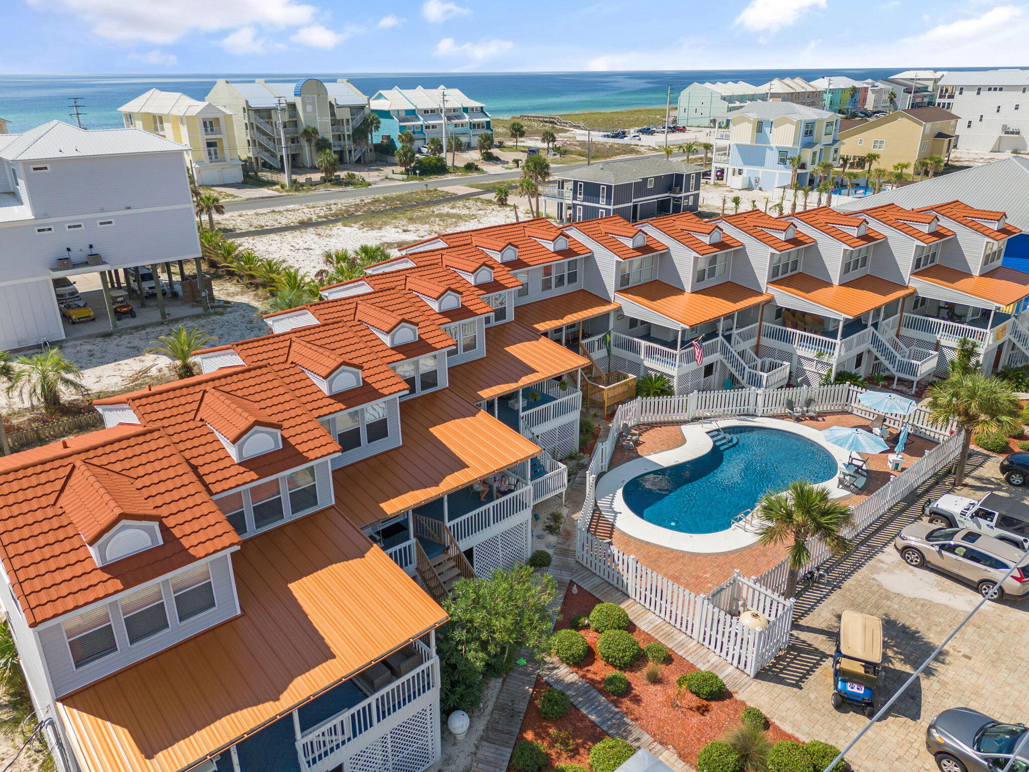 Your pool home dreams came true today on Navarre Beach! Where else will you find an amazing pool home with water views on the beach? Unit 3 has so much to offer. The home features 2 full bedrooms with some water views and plenty of natural lighting. The rooms with 2 full bathrooms are on the top floor and the main living area is below. The living room has views of the sound side with access to a private balcony that is new and freshly sealed a couple days ago. The balcony sliding doors are also brand new. As you walk around the corner into the crisp white kitchen, there is plenty of room to have a work station desk or kitchen nook. The bar top seating will sit 2-3 guests as well. The town home also has a 3rd bathroom for convenience without going up stairs to the top floor. If you enjoy the beach lifestyle without the waterfront prices, than this is a truly remarkable savings to make you the best savvy buyer around! The home features a private pool for home owners/ guests that are staying here. No short term rental permitted under 30 days though.
On the first level you will notice a relaxing shade area that makes a great entertaining space that includes a storage room, outdoor shower behind the wood door, and a spacious layout and walk way to the beach sand out back. Then you can also take the back yard stairs up to your private deck that leads to either the kitchen sliders or the living room area. 

The private GUNITE (concrete) pool was just resurfaced so you will see the quality and color that the homeowners (hoa approval) chose recently. 
The insurance and HOA dues are very low for these units. Please take a look at the document section for further consideration of a showing or offer. You will reap the benefits of being the new owner for sure. The assessements are already completed and paid for so the numbers are precise in the MLS listing. The seller is flexible with a move out closing date, so please bring your offer and let us know what you prefer. Some furnishings will convey and a list will be disclosed for review soon. This home is currently not rented out and is privately owned and lived in.
BONUS deal for you .... the GOLF CART will convey with the purchase. Photo is online of the exact one. Two parking spots are available for this unit in front of the pool fence that you will notice in the photos. 

