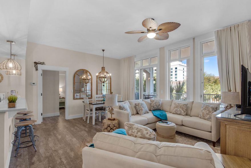 Tucked amidst the vibrant tapestry of Baytowne Wharf in Sandestin Golf & Beach Resort is a hidden gem: a top-floor, fully-furnished Market Street Inn condo, newly refreshed with an investor's eye and a touch of whimsy. This haven of peace, perched directly above the shimmering village pool, beckons both shrewd investors and sun-kissed second homeowners with its allure. Step inside and be embraced by the warmth of recent renovations. Gleaming stainless steel appliances dance alongside quartz countertops, reflecting the natural light streaming through the 10-ft. ceilings. New sinks and faucets shimmer with modernity, while a captivating tile backsplash adds a touch of coastal character. Interior paint, a tropical ceiling fan and coastal pendant lighting have all been updated; there's even a