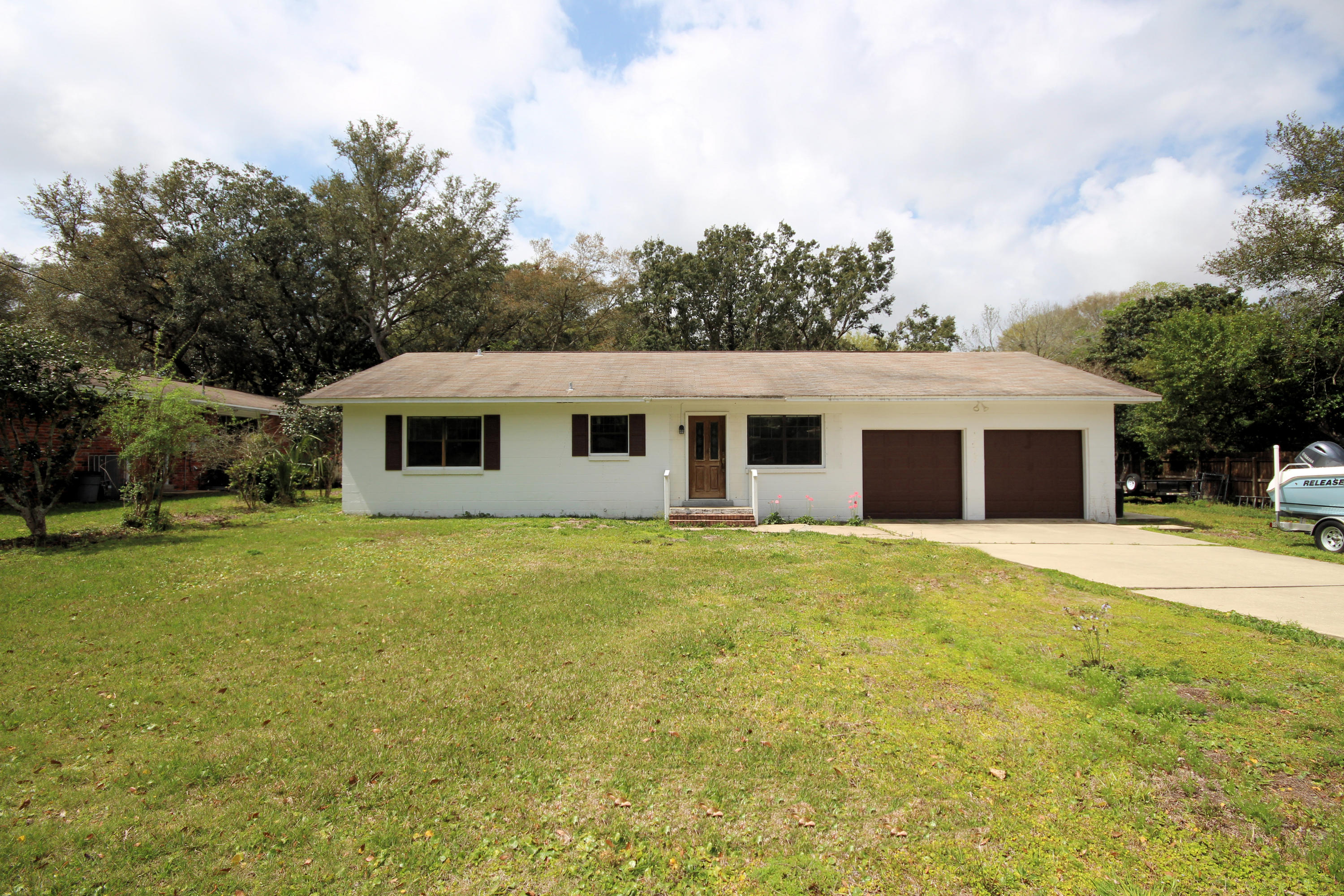 Incredible opportunity to own in the desirable Poquito Bayou neighborhood close to Eglin AFB! Affordable 3 bedroom, 2 bath home has an updated kitchen with new cabinets, appliances, and flooring. Home has been freshly painted and new carpet throughout. The ''L'' shaped open living area allows plenty of room for a dining area and breakfast nook. The family room, with a fireplace and sliding glass door, overlooks the large back yard. Garage is large enough for two cars and extra space for a workshop. The Bay Street boat launch is nearby. Residents enjoy the boat dock and launch, swimming area, playground, and picnic areas with NO HOA fees.
