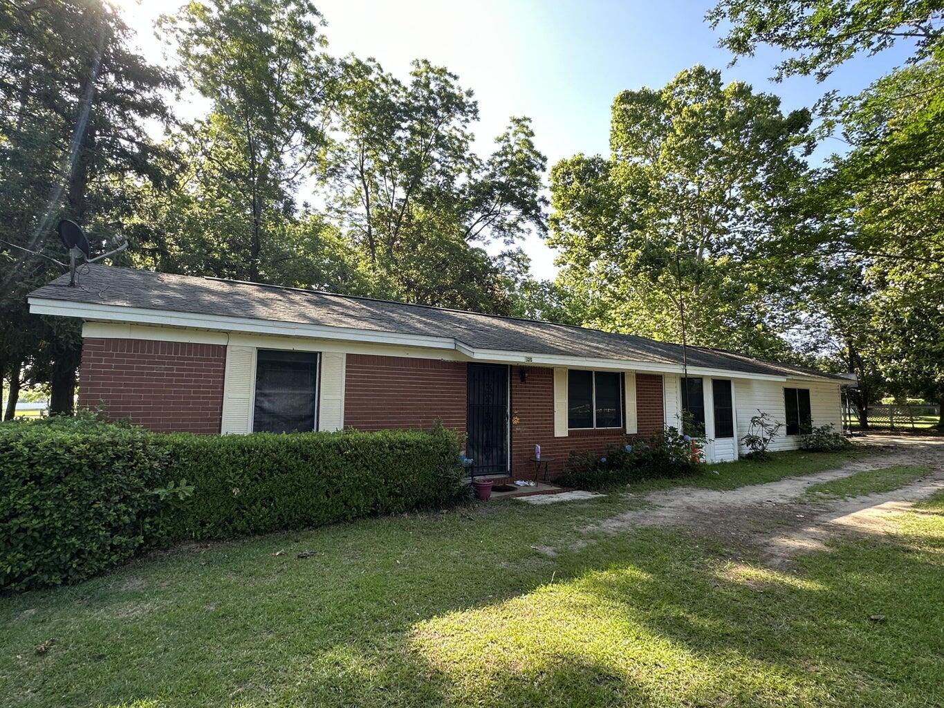 Ideal for a small business, satellite office, or creative studio, this property offers ample space to work and meet clients in a peaceful setting. Plenty of parking, flexible interior layout, and room to expand or add outbuildings if needed. Convenient location with easy access to main roads while still offering privacy and room to grow.