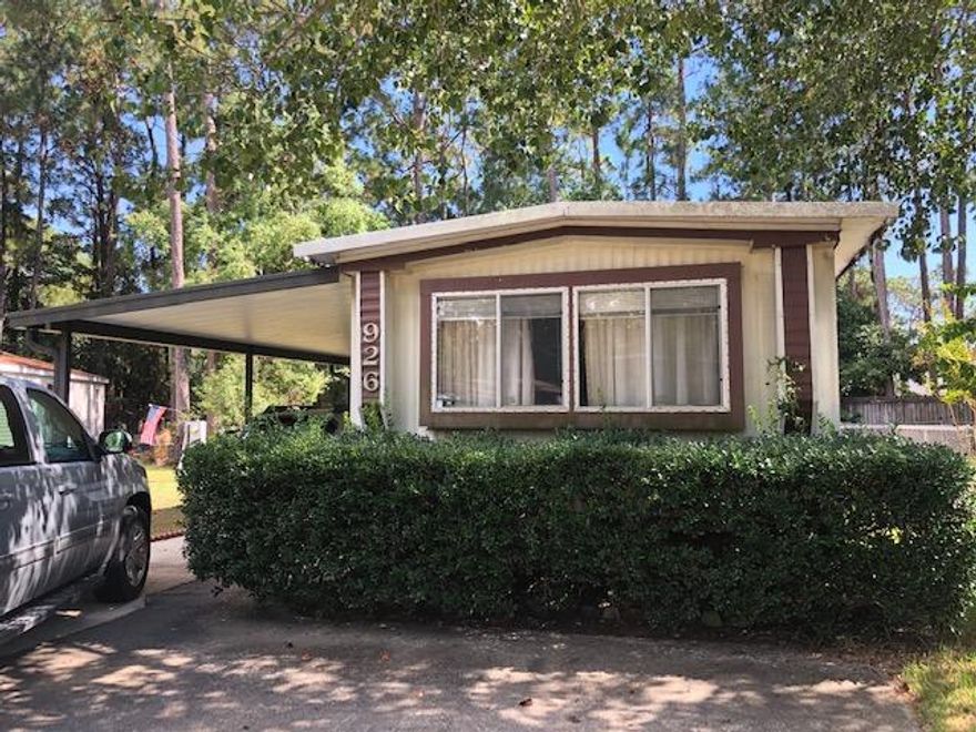 Mobile home on a nice lot in Bayshore Villas. There is a shed on the property and also a car-port. Mobile home needs a lot of work.