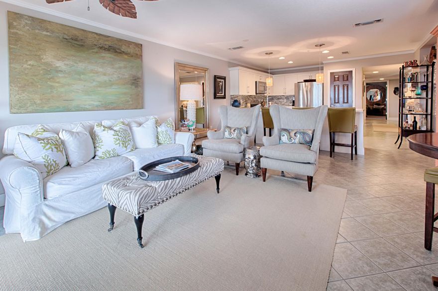 Sale includes coveted garage space worth $25,000! Totally renovated and professionally decorated is finally on the market! With just under 1,800 SF plus 1,300 SF of outdoor living space, this condo lives more like a home and truly is not to be missed. 2nd floor unit. Gulf facing master suite with sitting area, custom walk in closet, double vanity,separate tub and shower. Two additional large BR's both with their own full ensuite bath. Coveted covered parking plus large locked storage area. Amalfi has over 8 acres of manicured grounds,fenced and gated. Amenities galore: two tennis courts, fitness center, two pools, one heated and unobstructed Gulf views. Concrete and steel construction to withstand the most powerful weather. Original owner and loved as full time residence