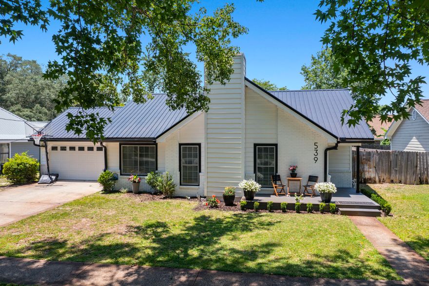 You don't want to miss out on this cozy 3 bedroom, 2 bath Florida cottage in the heart of West Destin! This home is by everything Destin has to offer. With easy access to Joe's Bayou boat launch, Destin Elementary, Baseball fields, and many great dining options.
With an open and stunning floor plan, this home is perfect for entertaining. This gourmet kitchen boasts luxurious granite countertops, a striking custom vent hood, and state-of-the-art appliances, creating a perfect blend of elegance and functionality. The shiplap walls add a touch of rustic charm, making the space warm and inviting. This beautifully designed kitchen is sure to inspire culinary creativity and serve as a central gathering place for family and friends. Step outside to your private backyard oasis! This spacious outdoor area features a lush lawn, perfect for children's play, gardening, or simply unwinding in the fresh air. The large patio is ideal for alfresco dining, barbecues, and amusing guests. With plenty of space, the possibilities are endless for creating your own outdoor haven. Experience an authentic coastal lifestyle here!