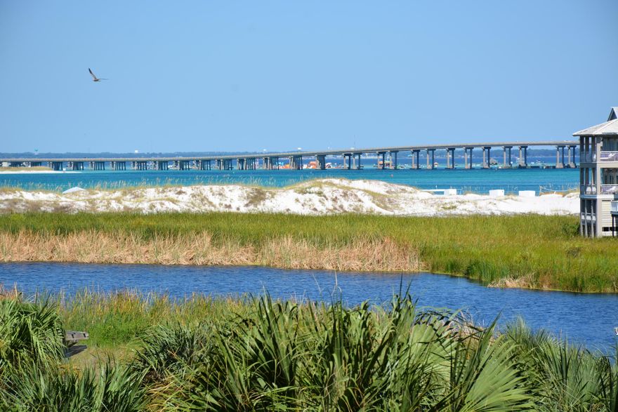 This renovated unit has beautiful views of the East Pass, Jetty and lake. The property features new high impact glass sliding doors and new window with plantation shutters. Pride of ownership is evident in this well maintained property. The unit is tastefully decorated in a neutral color palette. The living room has new blackout curtains, 50'' LED TV, a queen sized sleeper sofa and is open to the kitchen which which features quartz counter tops & stainless appliances. The large bedroom features a king sized bed. This gated complex with 24 hr. security has a beach side pavilion with BBQ grills, pool, hot tub, tennis courts, fitness & recreation rooms. Destin has great shopping, dining & many more amenities. The seller is providing a 1 yr. home warranty. Buyer to verify all dimensions.