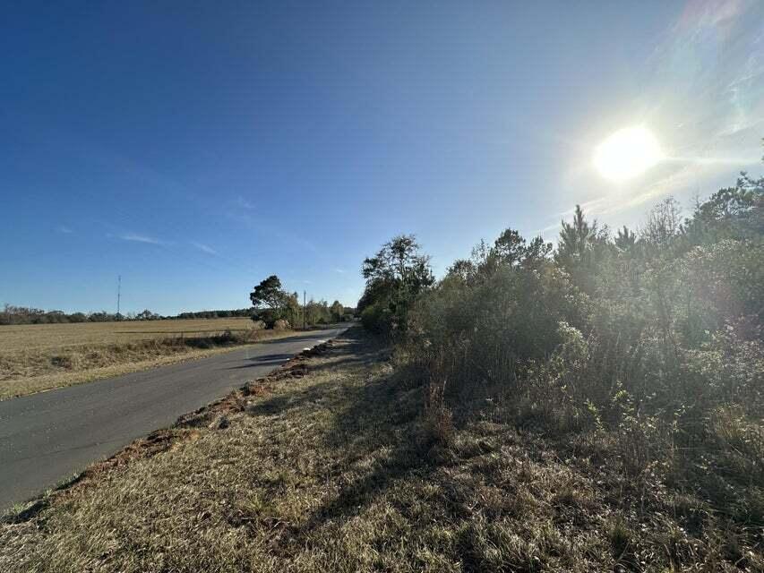 13+/- Acres In the heart of Laurel Hill. Private country living, but with city conveniences. Enjoy paved roads and easy access to utilities, With local churches, schools and businesses nearby. Bring your build plans today!