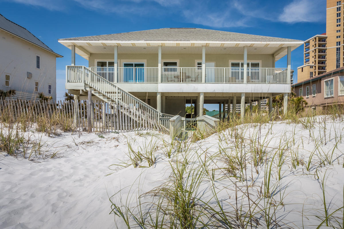 Home is on a vacation rental program and after summer season will be torn down to prepare this 100 foot beach lot for a new home. The present rental income is approximately $135,000 per year.THIS BEACH LOT IS A RARE 100 FOOT GULF FRONT LOT IN THIS WHOLE EMERALD COAST REGION AVAILABLE FOR A NEW BEACH HOME.