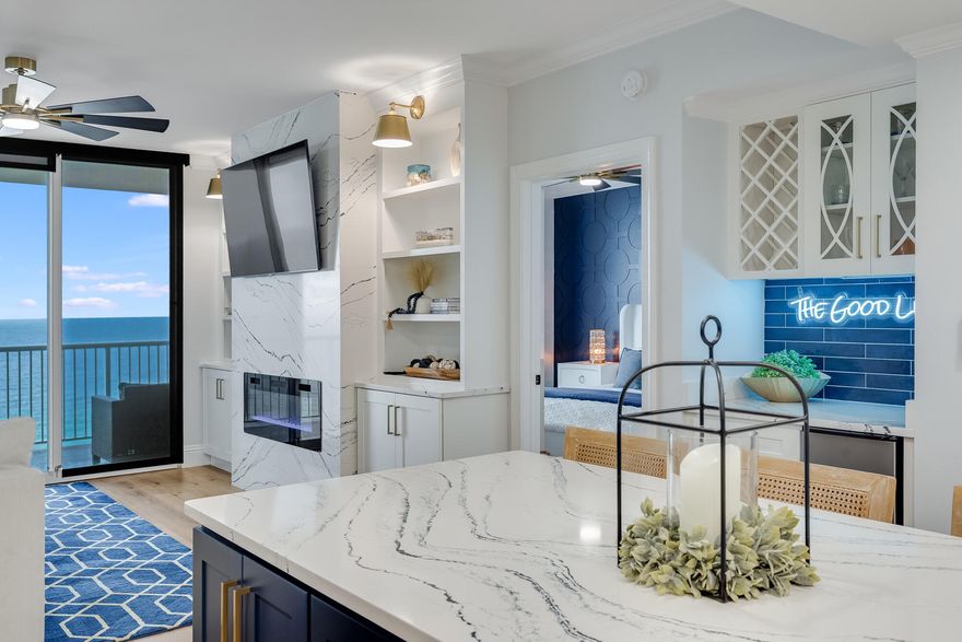 Palazzo Unit 802 | Gulf-Front Luxury Condo for Sale in Panama City Beach, Florida! Looking for a luxury Gulf-front condo in Panama City Beach that stands far above the rest? This is it!Introducing Palazzo Unit 802, a completely rebuilt beachfront masterpiece perched on the quiet west end of the Emerald Coast. This isn't your average renovation--it's a full-scale reinvention of what Panama City Beach luxury real estate can be.From the moment you enter this 8th-floor residence, you're greeted with wide-open views of the Gulf of Mexico through floor-to-ceiling glass. Natural light floods the interior, highlighting every custom feature and intentional detail throughout this professionally designed beachfront condo. The kitchen is a true showpiece, anchored by a sculptural Port Rush Cambria quartz island, flanked by soft-close cabinetry, designer lighting, and a built-in Whirlpool ice maker that produces 50 pounds per day. This is not just a kitchenit's a space designed for connection, creativity, and coastal entertaining.
Across the main living area, the same bold quartz wraps a custom fireplace wallframing the living room like a gallery. Kitchen, dining, and living spaces flow effortlessly together and open to an oversized Gulf-front balcony offering panoramic water views, salt air, and that rare feeling of absolute stillness.
The Gulf-facing primary suite is a true retreat. A walk-in closet, spa-style bathroom, double vanity, and a glass-enclosed shower with a luxury tower system and tile ceiling complete the experience. Every finish feels elevated, intentional, and truly custom.
Two additional bedrooms, including a second king suite, offer space and flexibility, while the bonus bunk area delivers charm and functionality, perfect for guests or short-term rentals. All three bathrooms have been completely redesigned with marble-inspired tile, high-end fixtures, and modern vanities, blending beauty and practicality.
No detail has been overlooked. Behind the walls: new HVAC, new water heater, new electrical and plumbing systems. This home is not only stunningit's solid.
Palazzo is a premier Gulf-front condominium known for its low density, strong HOA, and resort-style amenities. Residents and guests enjoy a heated beachfront pool and hot tub, fitness center, private beach access with chair service, covered parking, pet-friendly walking area, and no special assessmentsa rare and valuable advantage.
Located just minutes from Pier Park and Scenic 30A, this unit offers excellent short-term rental potential and long-term investment value in one of the most desirable areas of Panama City Beach.
Palazzo Unit 802 is not just move-in readyit's magazine-worthy.
Three bedrooms. Three luxury bathrooms. Bonus bunk area.
Turnkey. Fully furnished. And unforgettable. Call today before it's gone.