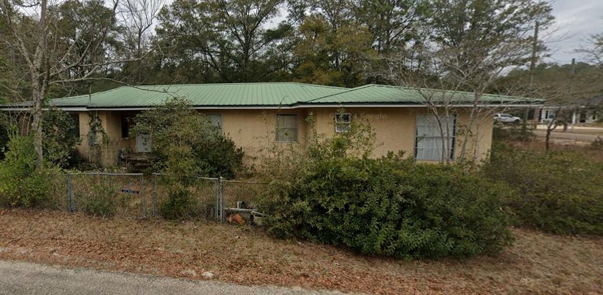 SELLER FINACING AVAILABLE! This 5 bedroom, 2.5 bath home is a fixer-upper with endless potential. Situated on 0.25 acres within city limits of Defuniak springs., it offers a solid foundation with a metal roof. Though it still needs work. Some renovations have been started, but there's plenty of opportunity to complete and personalize the space to your taste.If you're looking for a property to restore and transform into your dream home, or an investment property this is the perfect canvas to bring your vision to life.