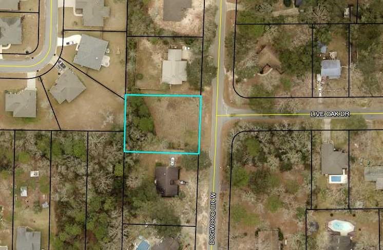 Ready for you to build your dream home. Level lot and not much to clear. Just minutes from shopping and schools. Quiet location. Well established neighborhood. Water and Electricity are available on W Dogwood Drive. Located just outside the city limits, no city taxes! Take a look today. Buyer to verify any and all information they deem important.