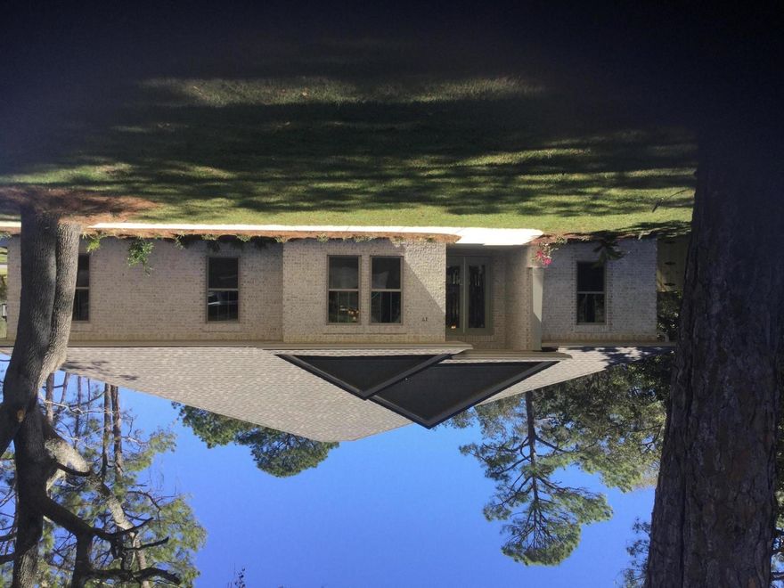 New All Brick home under construction and ready for move in by July 2018. Located in the highly desired Shalimar Florida Poquito Bayou neighborhood minutes away from Beaches and Military Bases.Home features include: 8ft. Entry Door, Open style floor plan, Kitchen with a 15ft island bar, Custom All wood Shaker Style Cabinetry with soft close doors Granite countertops, under counter lighting, and Kenmore stainless appliances. Also features 9' and 10' ceiling heights throughout with upgraded Shaker style trim package including 7'' base boards, 7'' Cove crown molding and 3-1/2'' door and window trim.