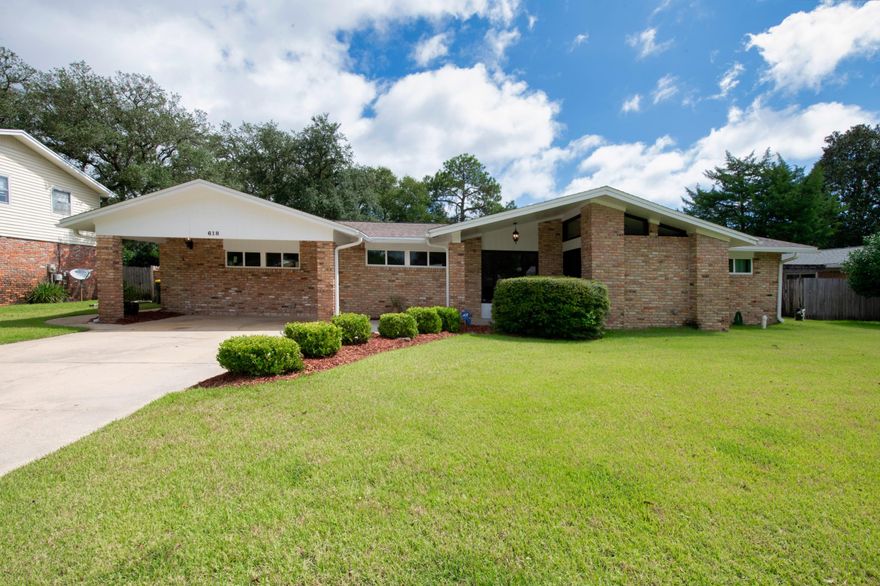 This Kenwood brick home is ready for new owners.  As you enter the foyer you are greeted by the slate tile entry way which flows into the hardwood floors which lead into the dual living rooms, kitchen and dining room.  The kitchen features an all brick stove top island, black granite countertops and a breakfast bar. The home has a unique blend of rustic/modern features with white cabinets and a brick accent wall.  There is lots of natural lights with large windows overlooking the backyard.  The home has a solar hot water heater for energy efficiency. Other new features include new pool filter and timer, lawn pump and sprinklers, new bath tub insert from Bath Fitter, inside A/C handler, nest thermostat, and vent speakers with blue tooth capabilities.  The roof was replaced in 2016.  The the fenced in back yard is an oasis getaway with an open patio area, lush landscaping and a large in-ground pool which is great for relaxing or entertaining.