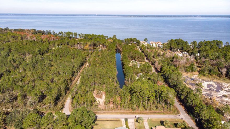 Great Development Opportunity! This lot is a great location just steps away from the Bay to build your dream home. Enjoy the quiet of the nature with the convenience of city living.3 lots are being sold separate, side-by-side, or can be sold combined at a discounted bundle rate of $170,000.