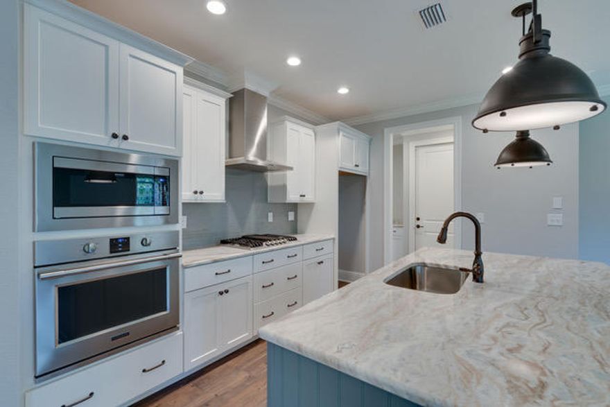 5 BEDROOMS!!! 3 1/2 BATHS!!!!  Rare find in Niceville by locally renowned builder minutes from Ruckel Middle School and Niceville High School.  Short walk to Boggy Bayou and Lyons Park.  Short to commute to Eglin.  New construction in this location with these finishes - what a great opportunity for your buyers.  This 2 story home features a great family room that adjoins the gourmet kitchen and breakfast area.  The open kitchen features a large island with quartz counter tops and bead board surround.  Fridgedaire professional stainless appliances including a gas 5 burner cooktop, built in oven and microwave and stainless Electrolux hood make this kitchen a cooks delight.  This home also features Woodharbor cabinets in the kitchen and all baths - 100 year warranty!!