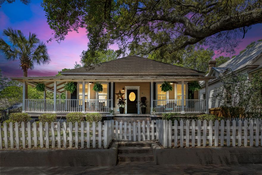 Historic 3 bedroom home in the highly desirable East Hill area of Pensacola now on the market!  Welcome home to a white picket fence surrounding the front of the home and steps that lead onto a wrap-around front porch that is perfect for relaxing on a bench swing/rocking chair. From the foyer inside, you'll find beautiful hardwood floors throughout and an open concept with natural lighting.The living area has another fireplace and large windows looking over the pool.Three spacious bedrooms with ceiling fans and original fireplaces. The primary bathroom has a large walk in shower with custom tile.The kitchen has an island with additional seating, stainless appliances including a gas range, a pantry and double doors leading out to the extensive deck with a grilling area and a